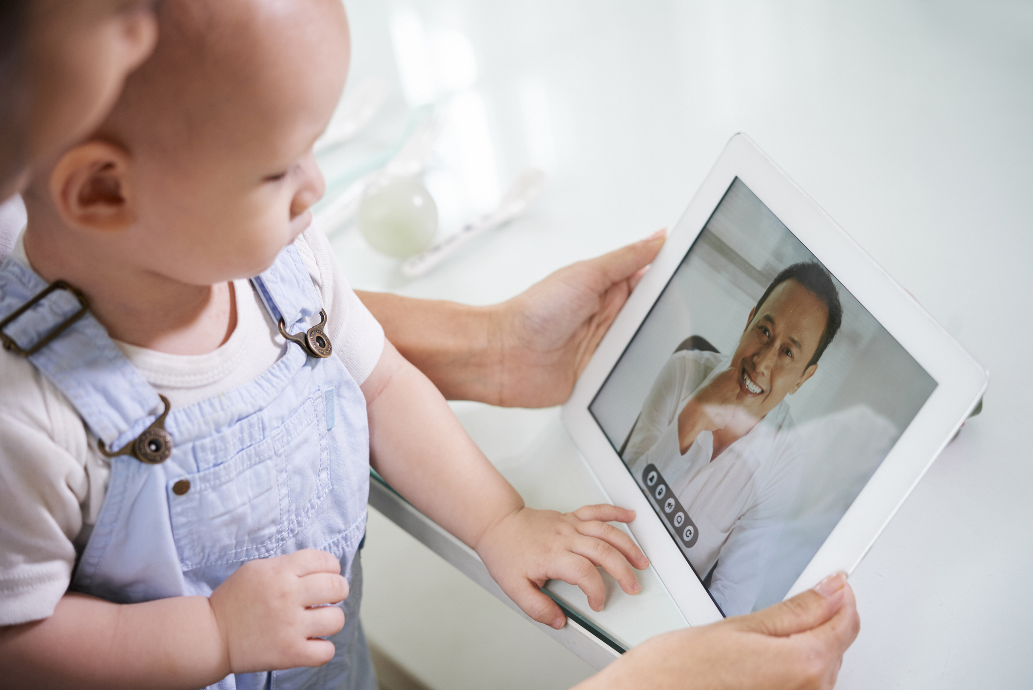 telemedicine baby looking at computer