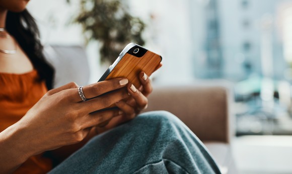 A person holding a smartphone.