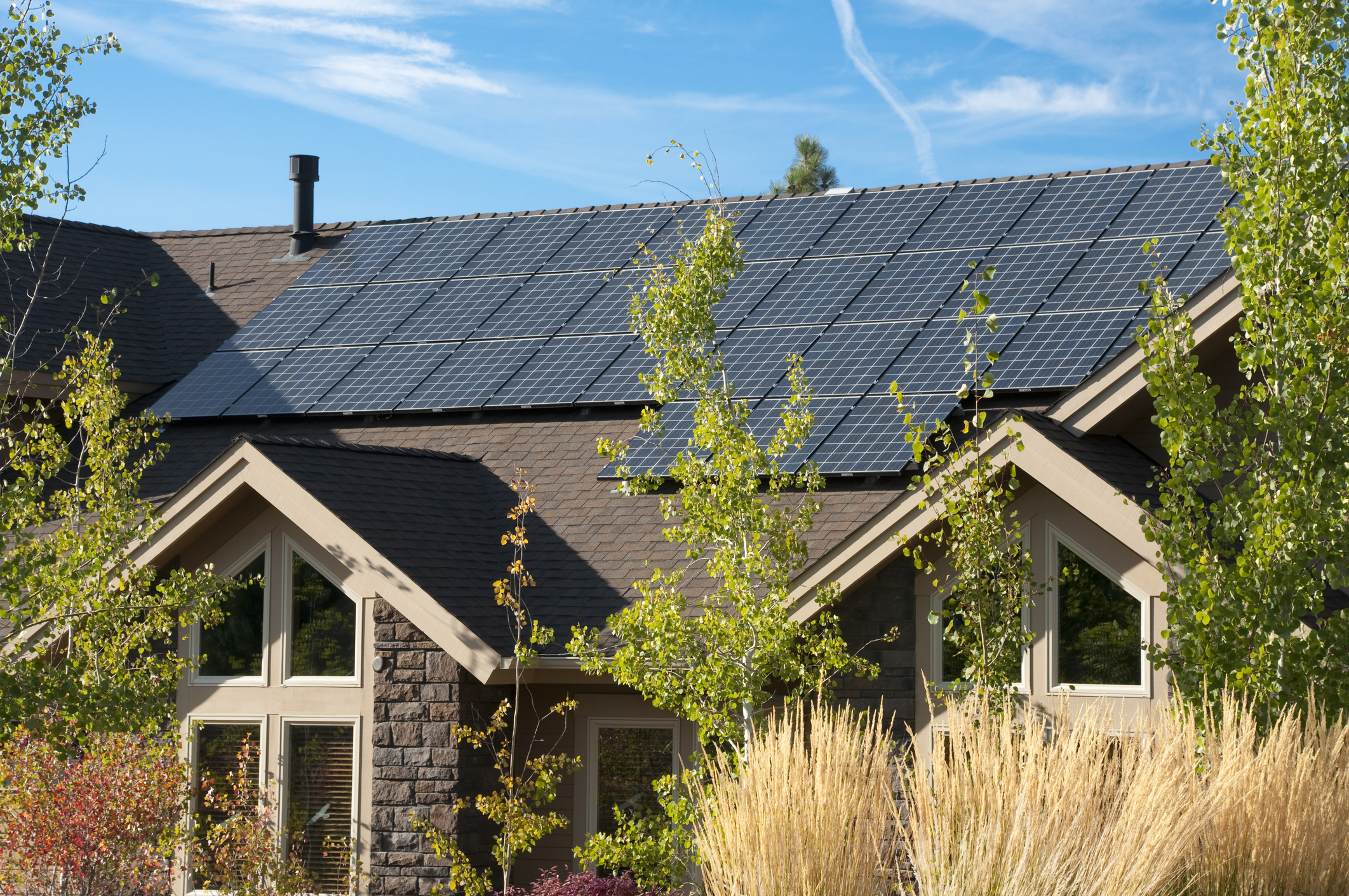 A home with solar panels on the roof. 