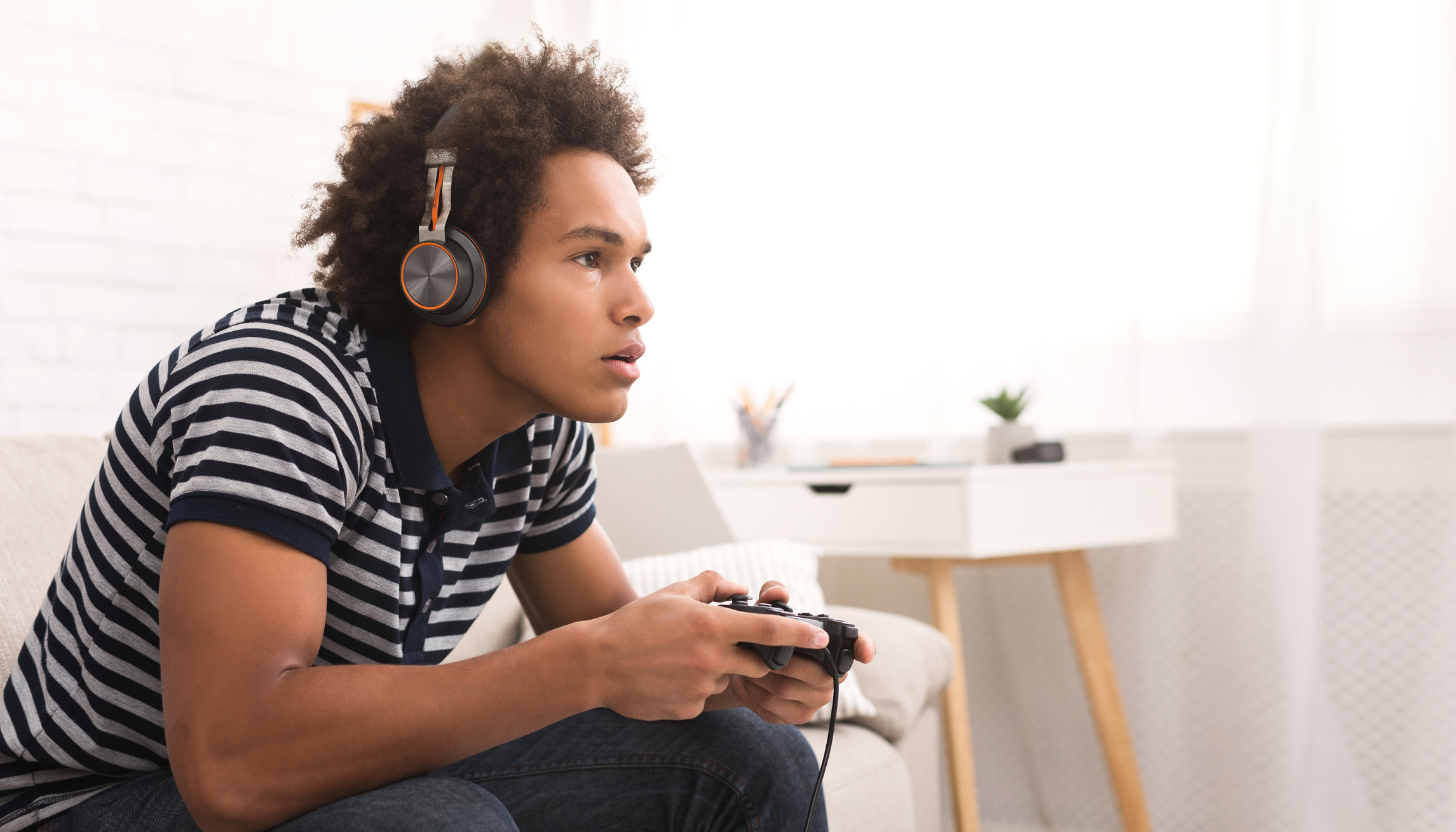 A video gamer focused on the action.
