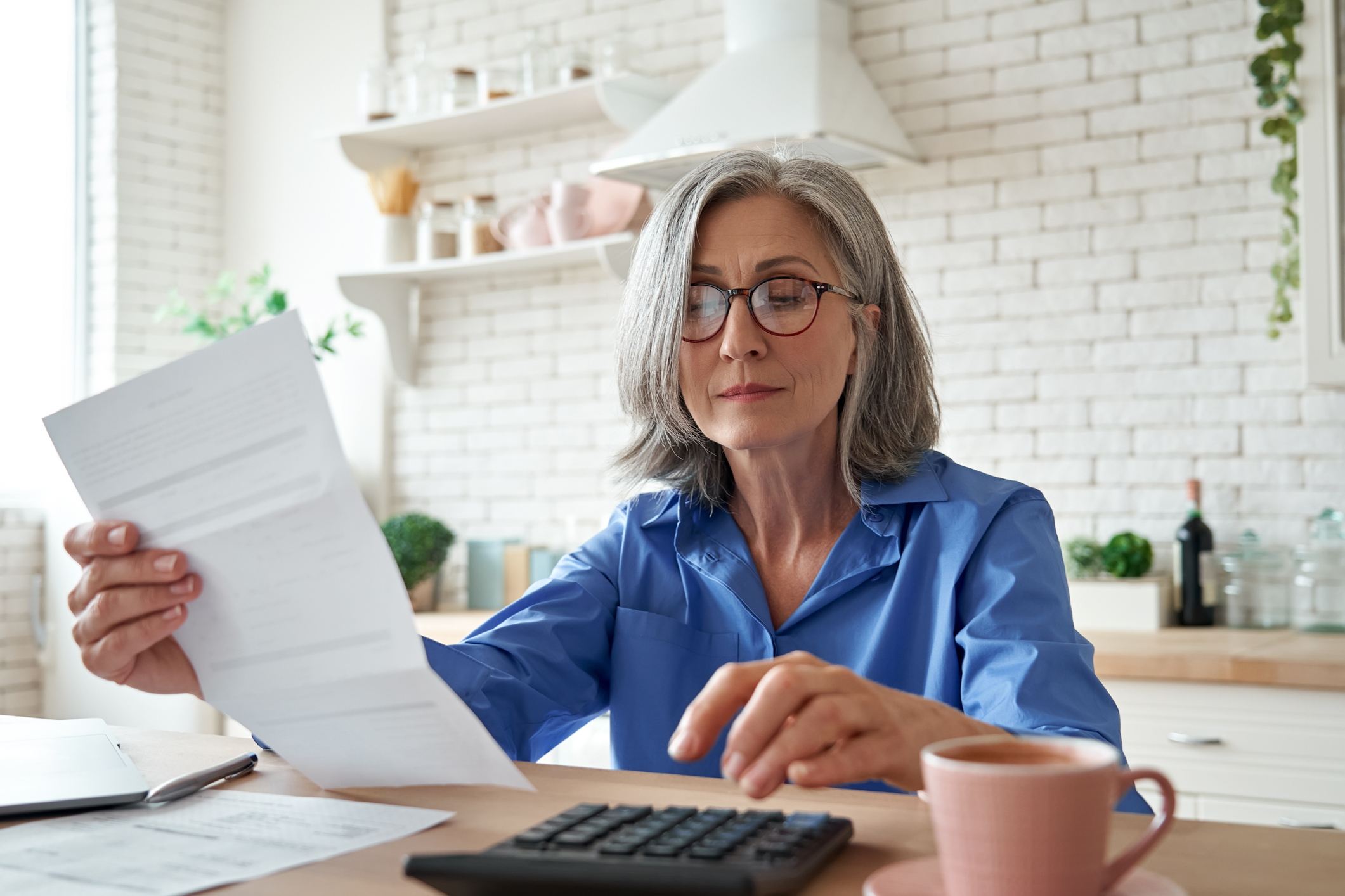 A person reviewing personal finances at home.