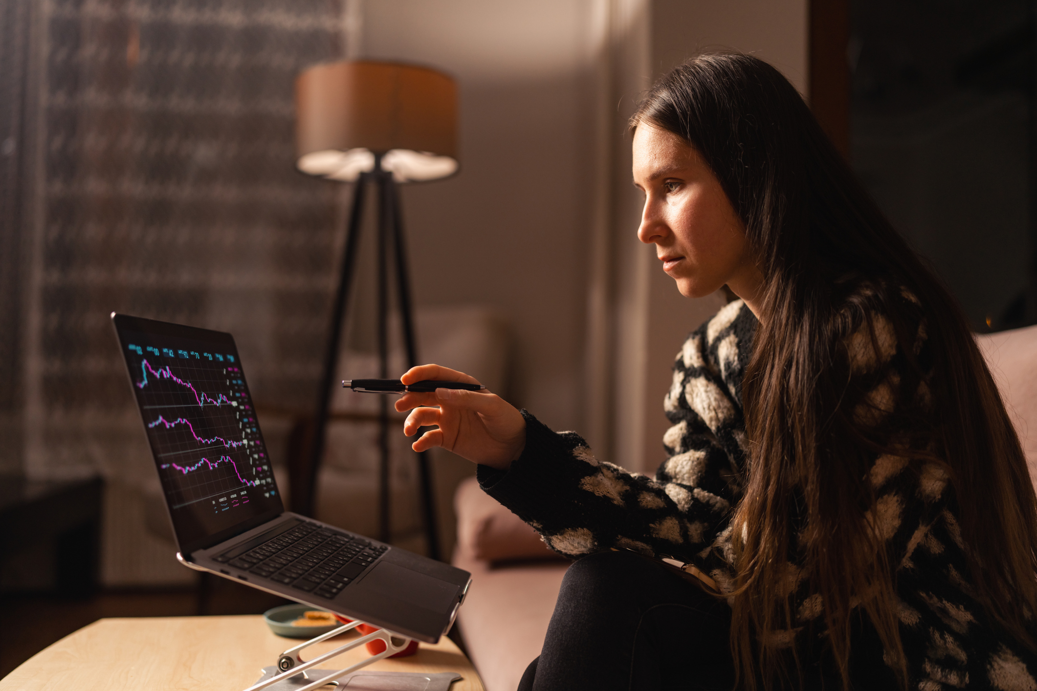Investor looking at stock charts.