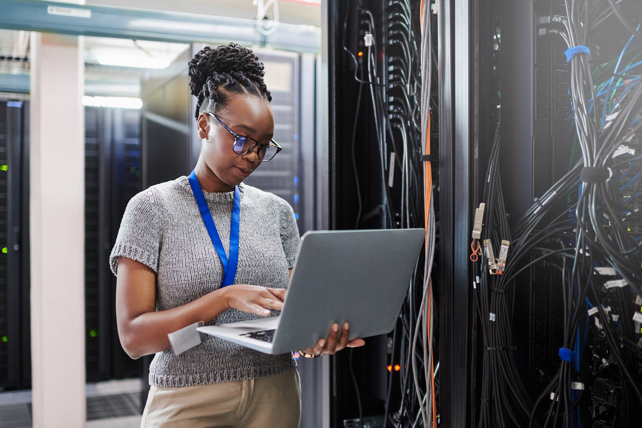 A person checks protocols inside of a data security center.