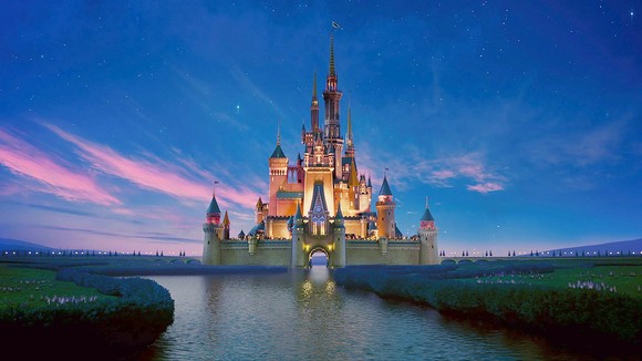 Disney's Cinderella Castle concept art overlooking the water.