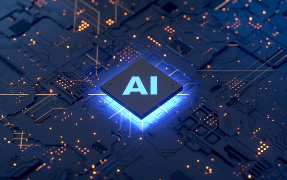 Semiconductor computer chip with the letters AI in the middle.