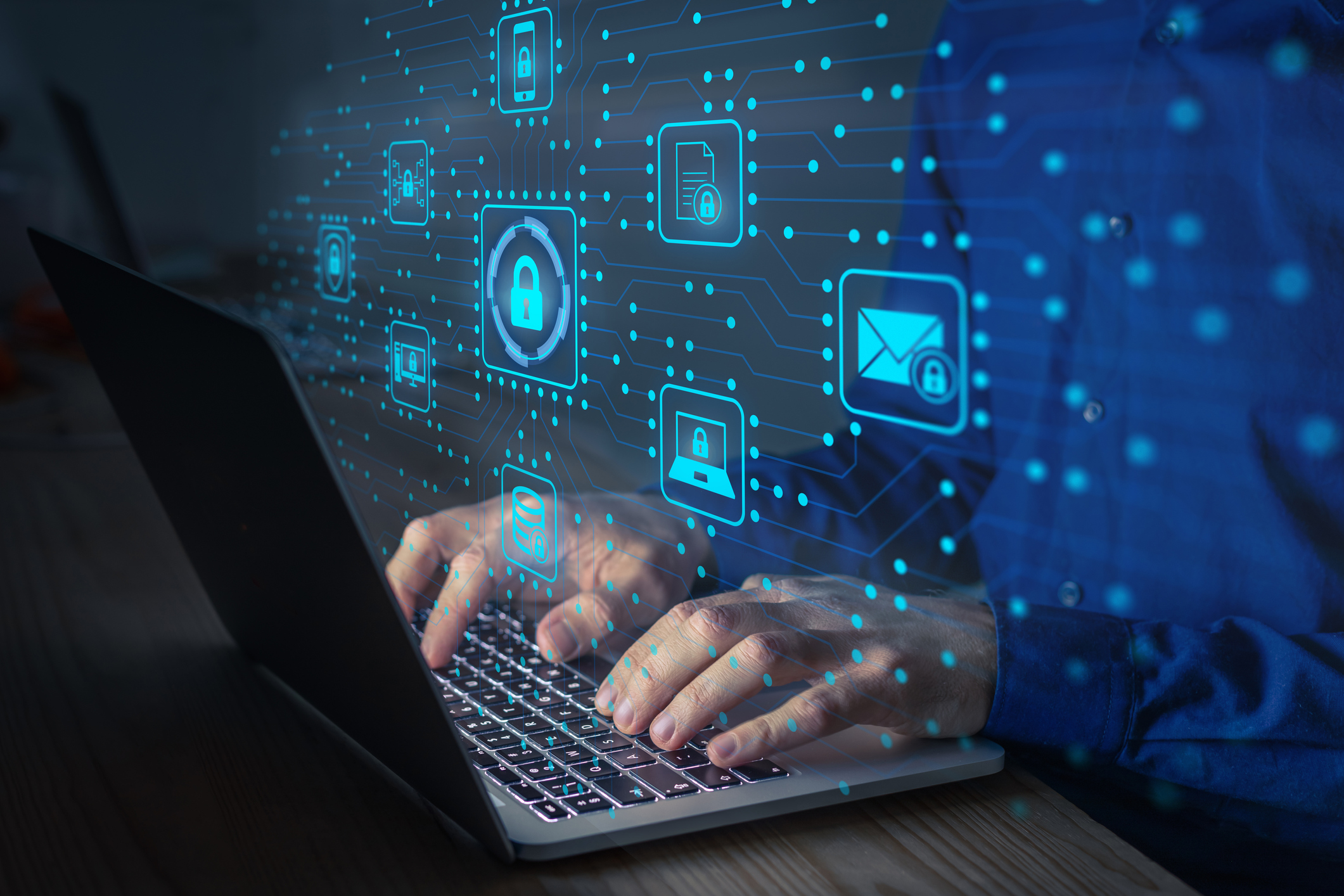 A person works on a secure laptop.