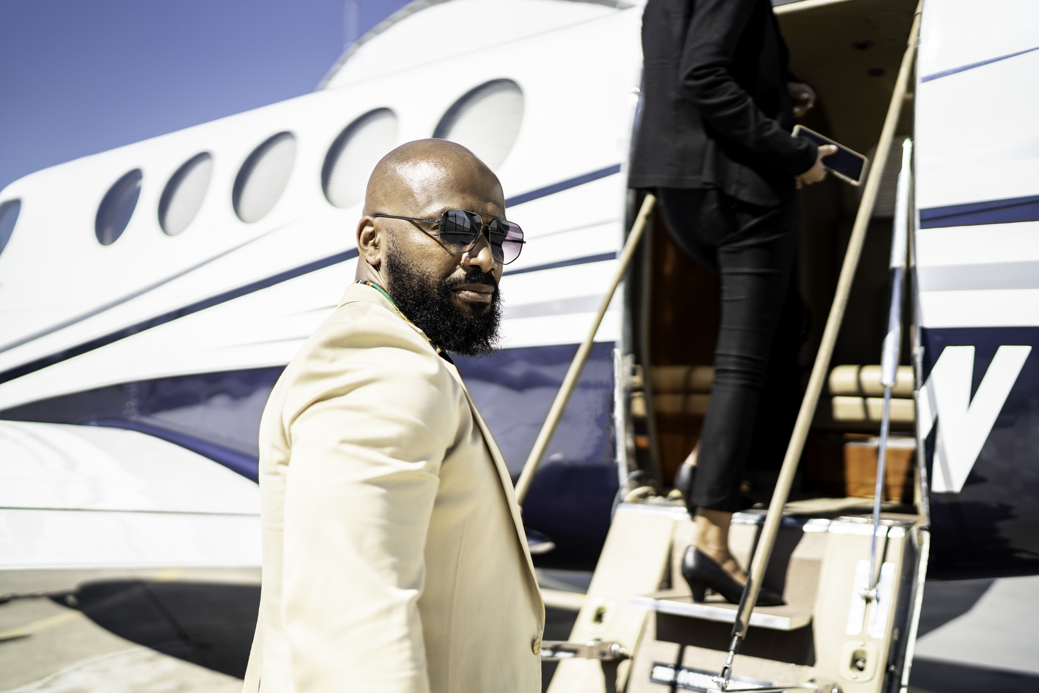 A person boards a corporate jet.
