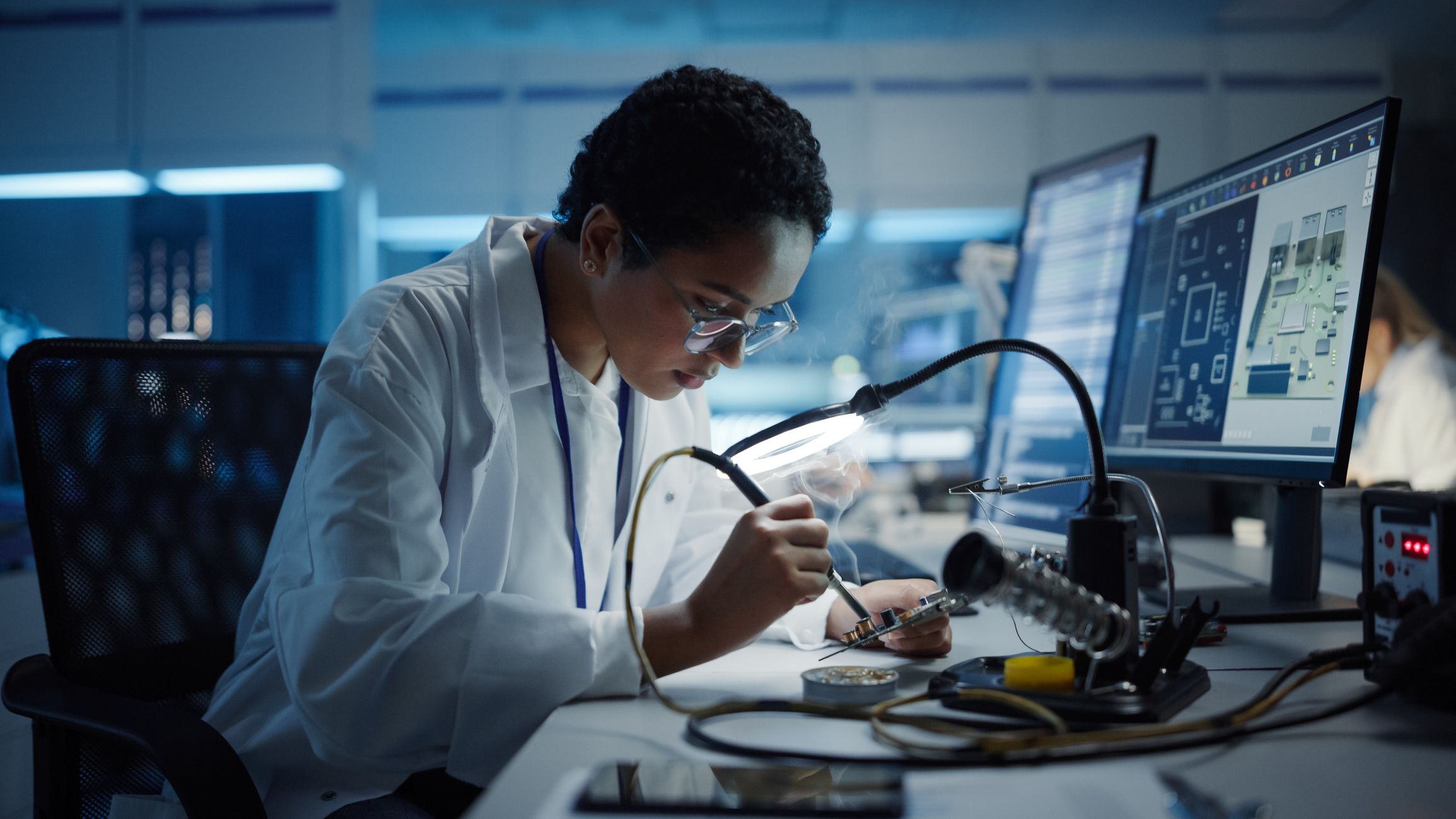 An engineer working in a semiconductor lab.