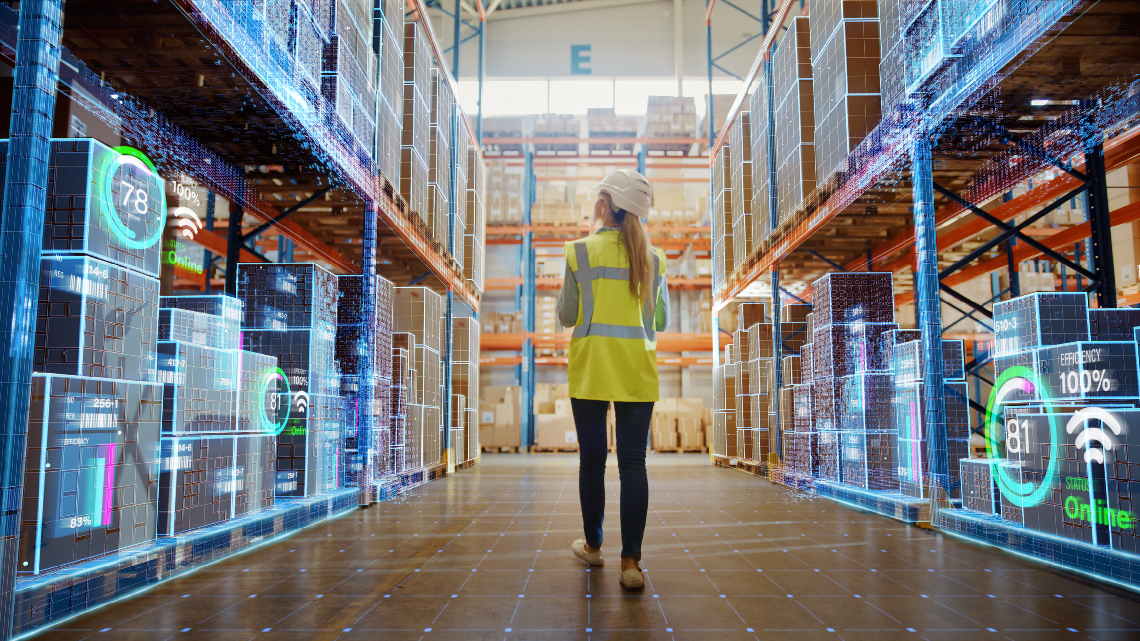 Person walks through industrial warehouse.