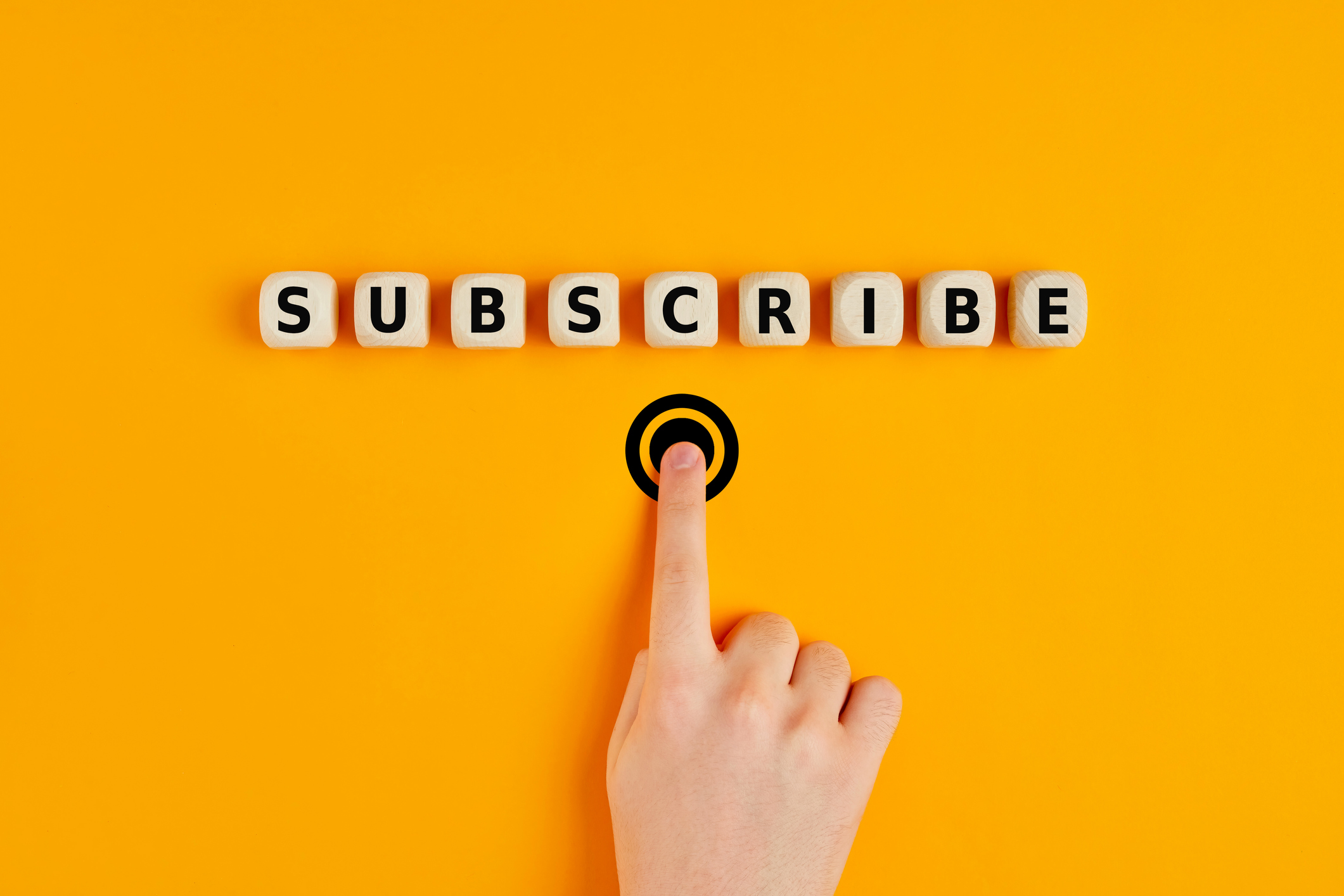 Person pressing a subscribe button.