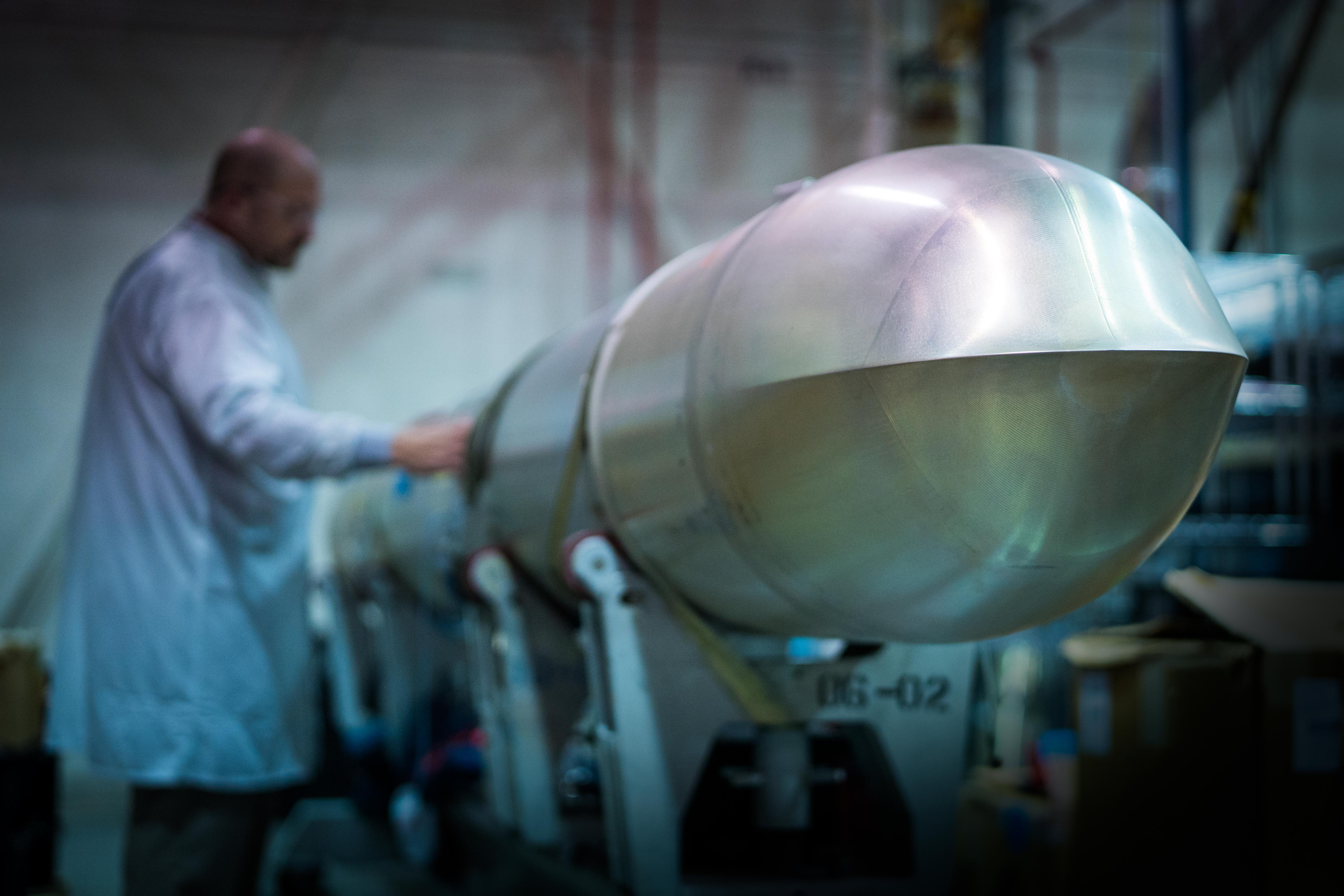 Engineer running a quality check on a Raytheon Tomahawk missile.