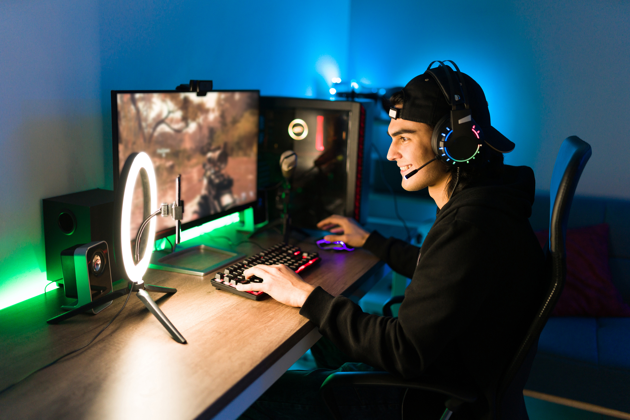 A gamer playing a video game on a PC while streaming.