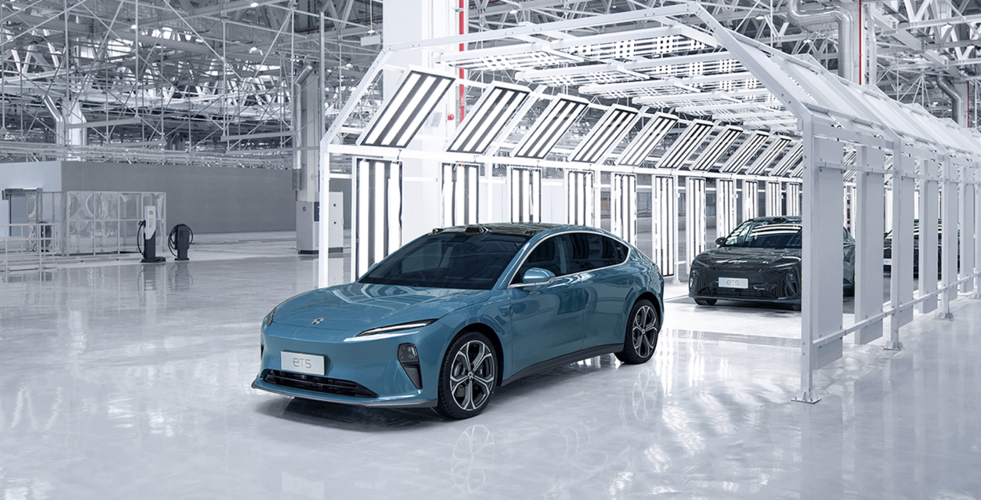 Slate blue ET5 mid-size sedan coming off production line.