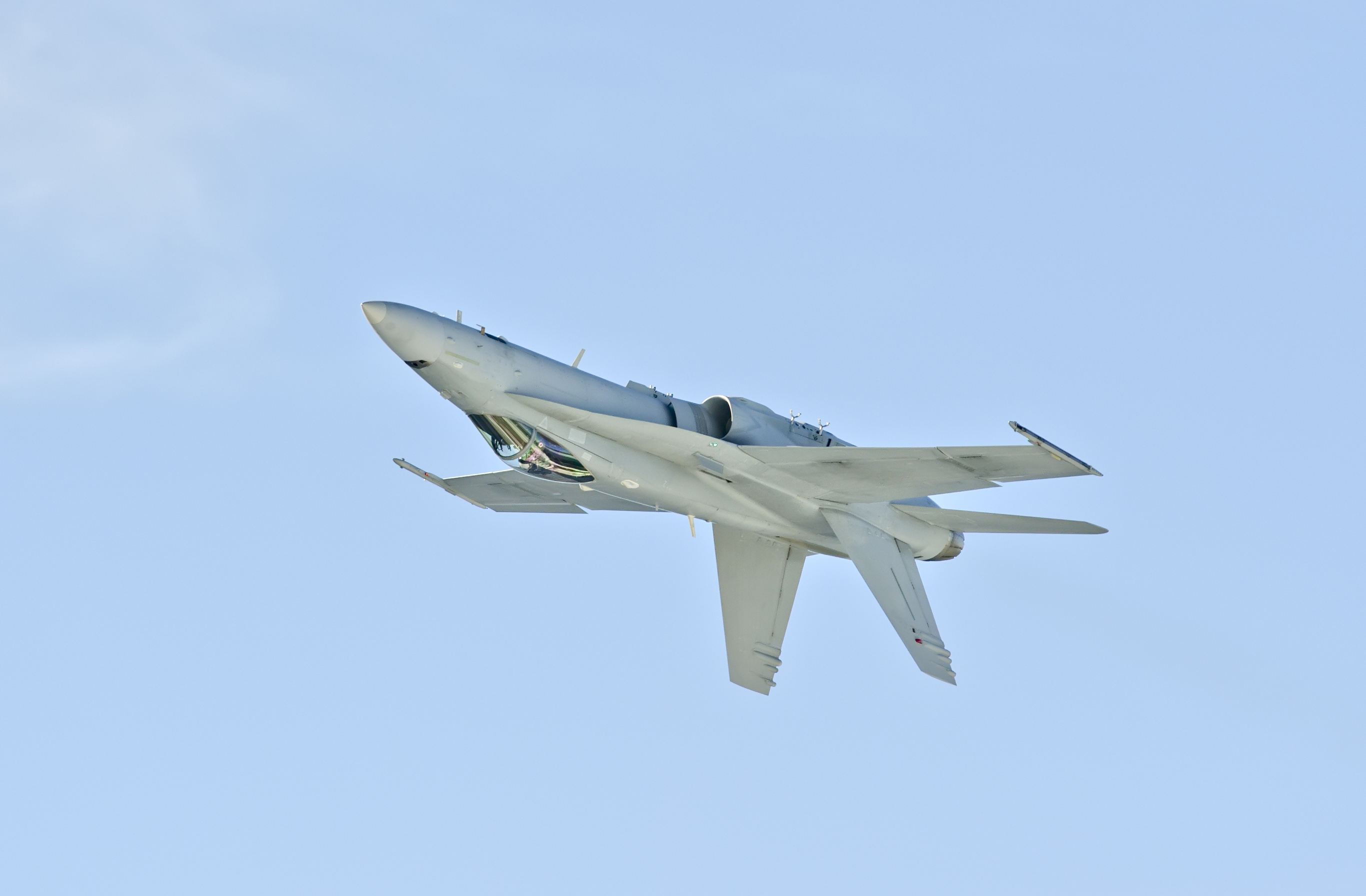 Boeing FA-18C fighter jet flies upside down and sideways.
