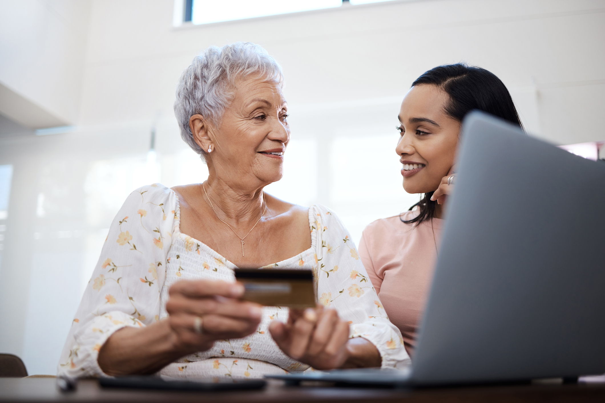 Old and Young Lady Making Credit Card Payment
