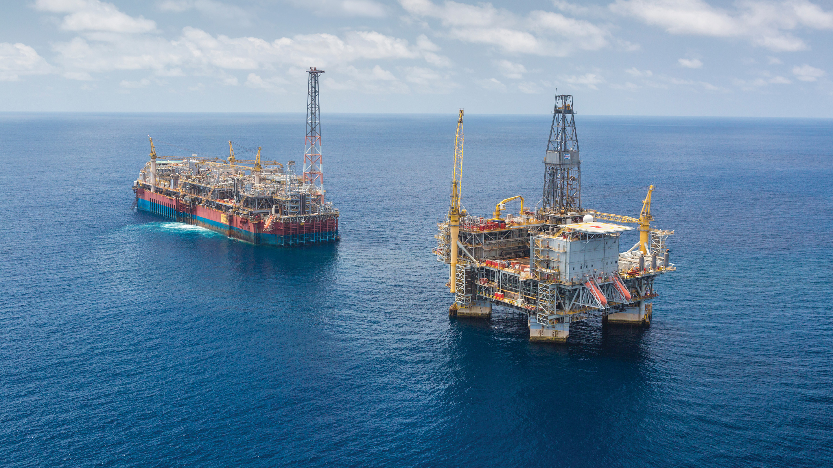 Offshore oil rigs in the ocean.