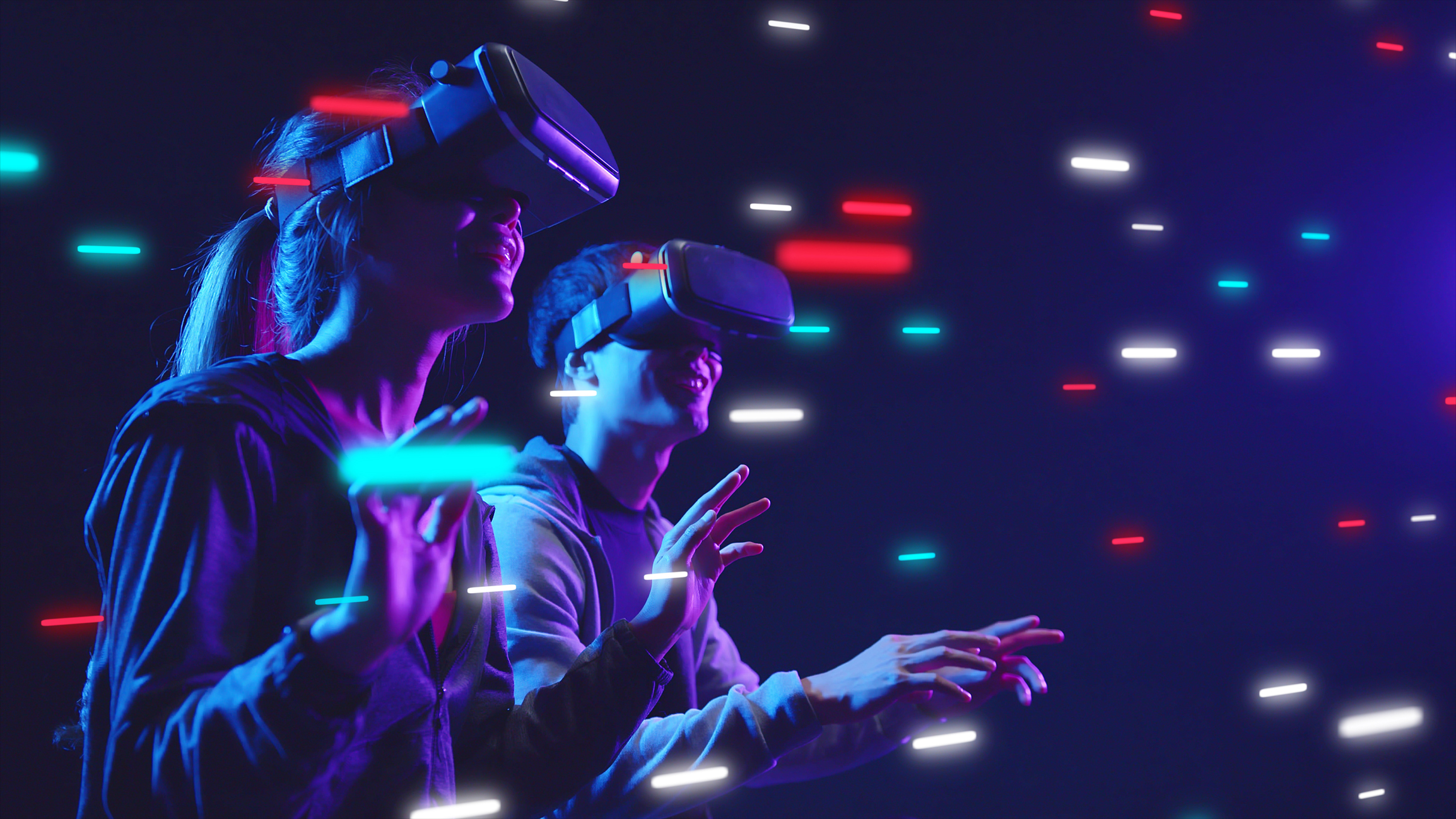 Two people explore a VR environment.