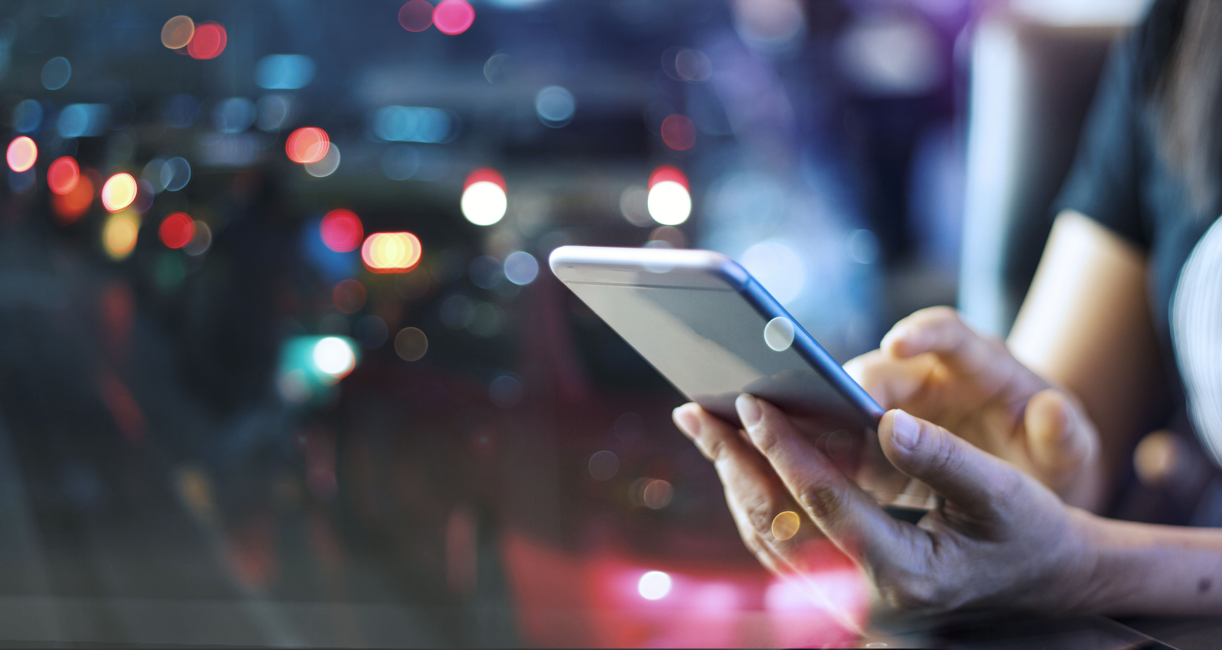 Mobile phone in hand.