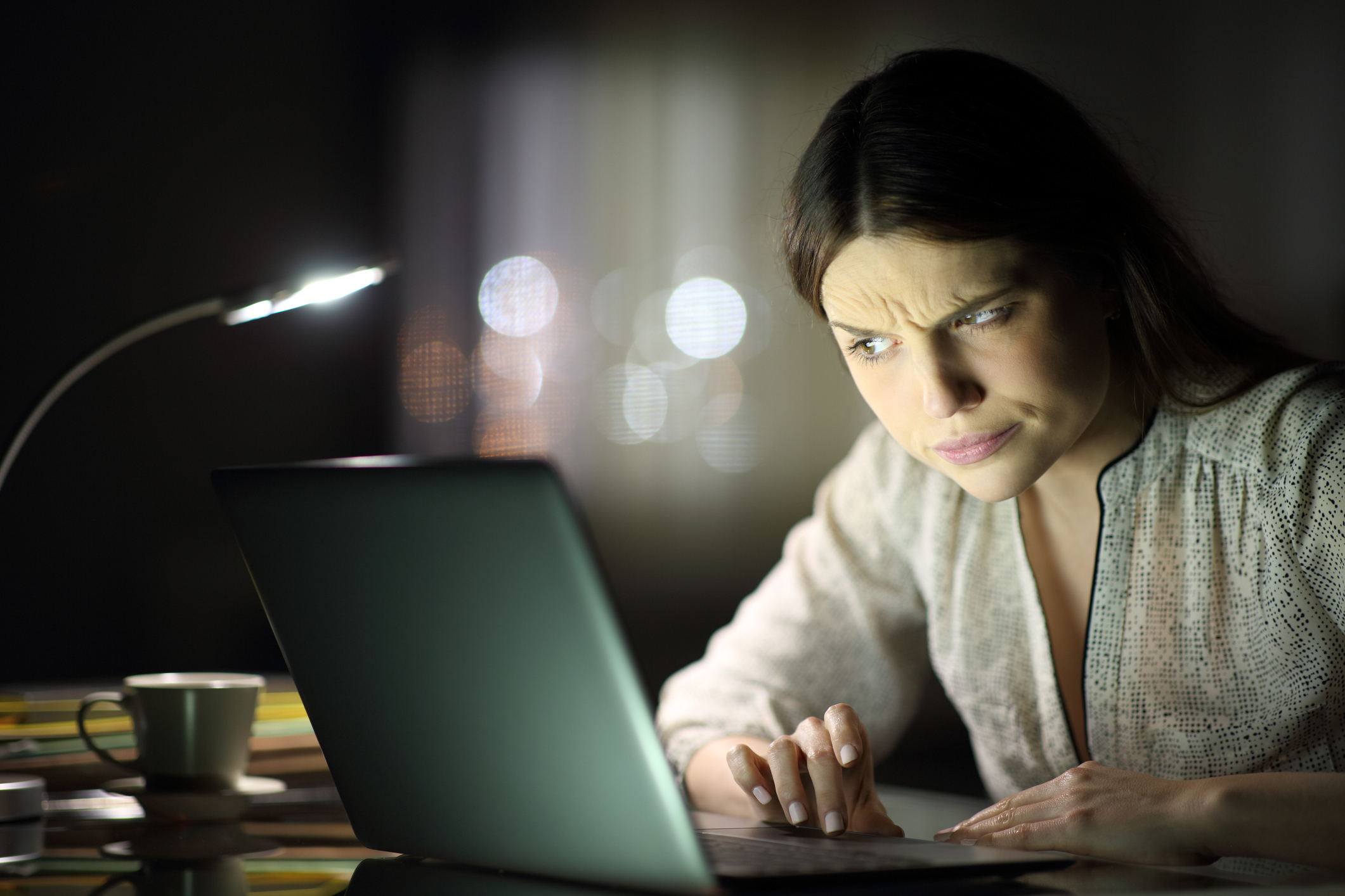 A person looking at a laptop.