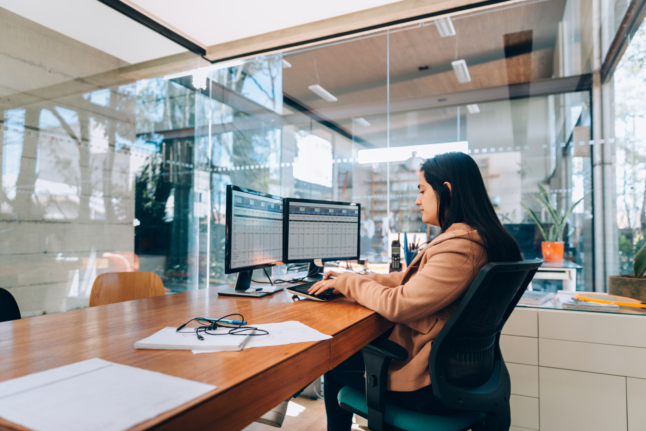 A businessperson works in their office.