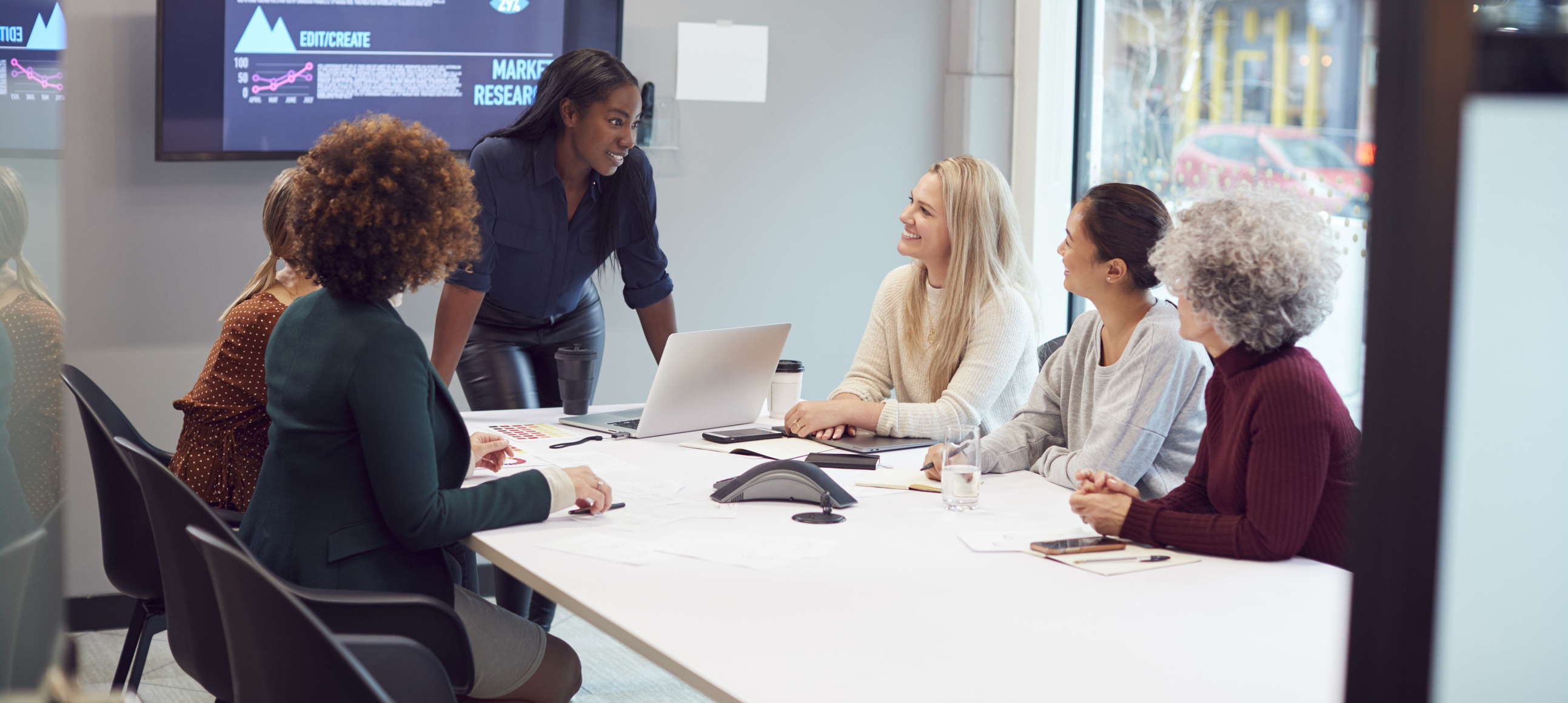 People talking in a marketing meeting.