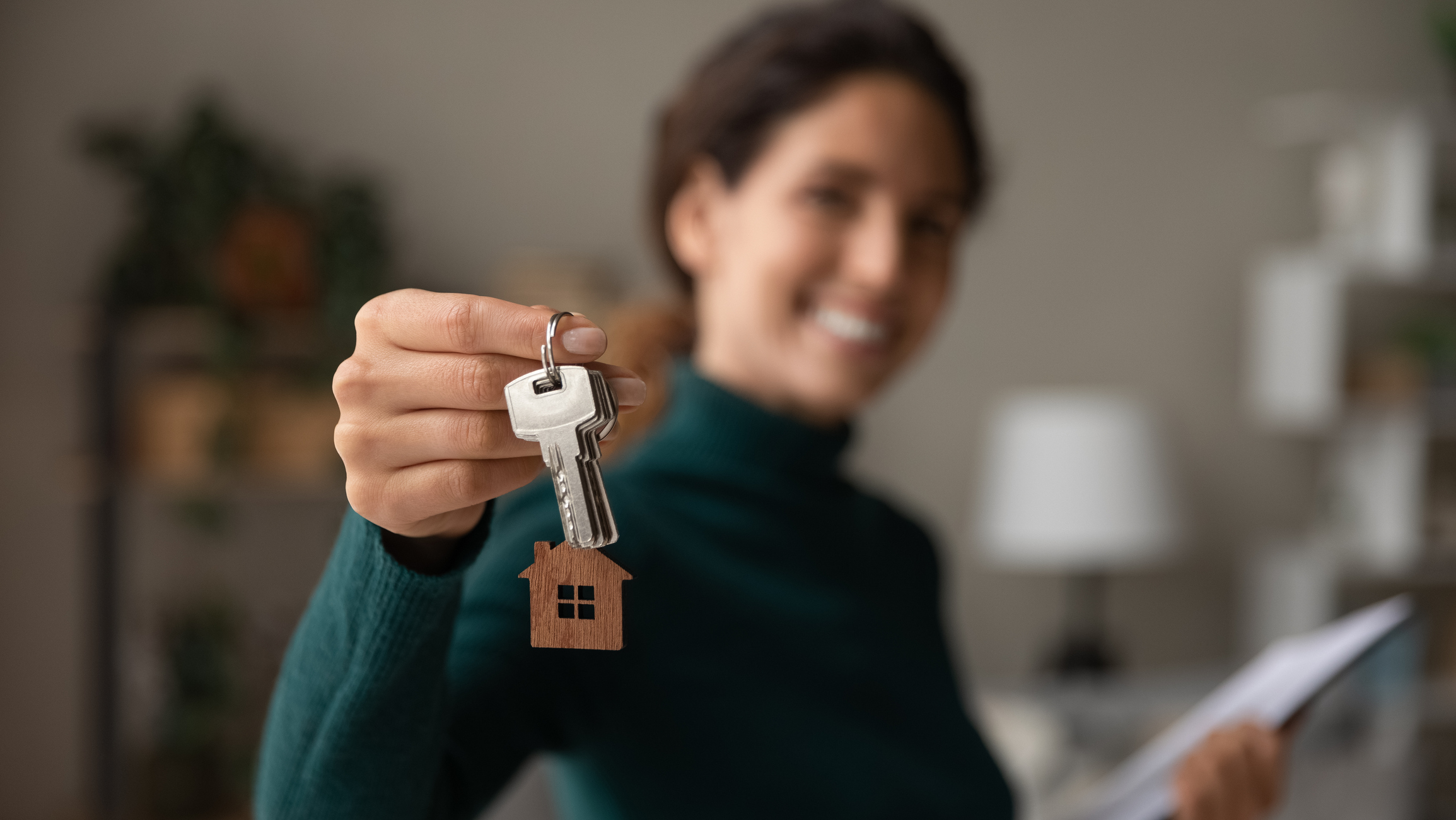 Person holding house keys.