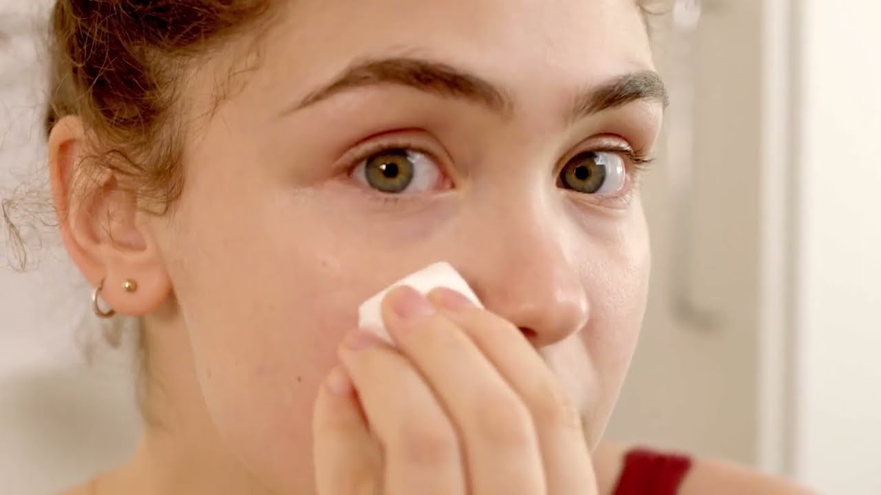 Person wiping face.
