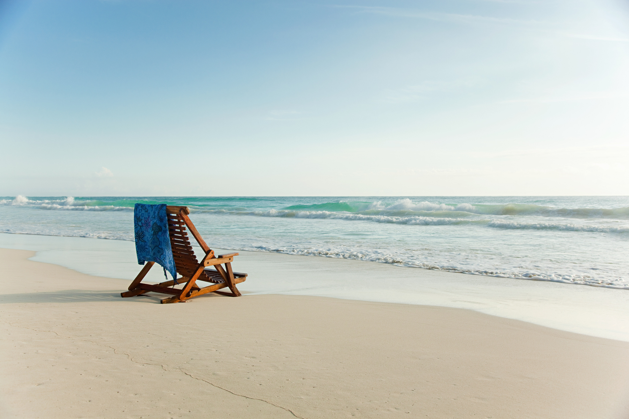 A chair set up on the beach.
