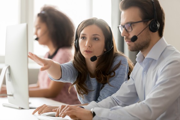 Customer service representatives working at a call center.