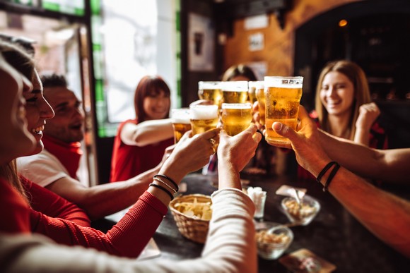 Group celebrating with beer.