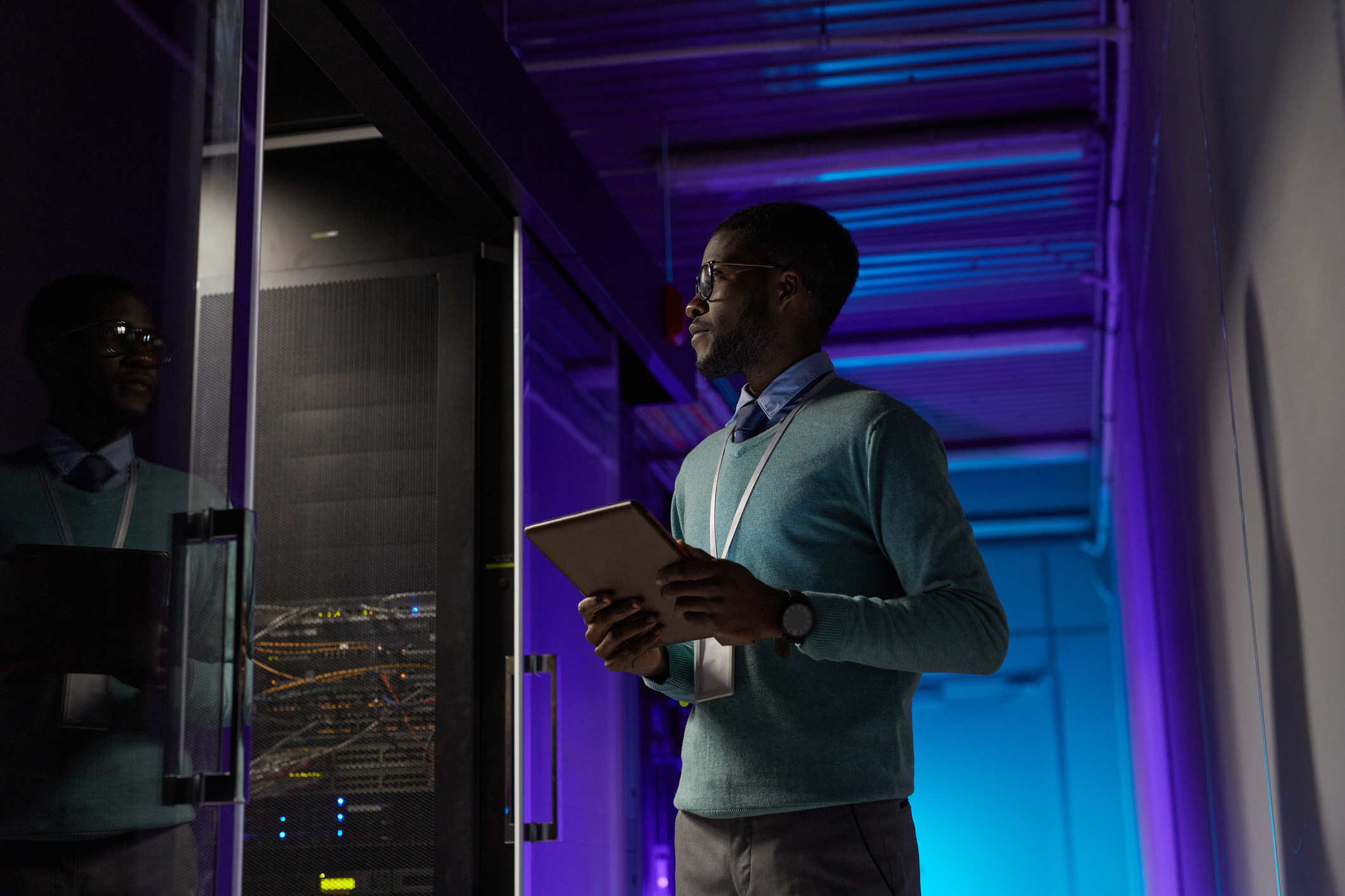 A person is working in a data center.