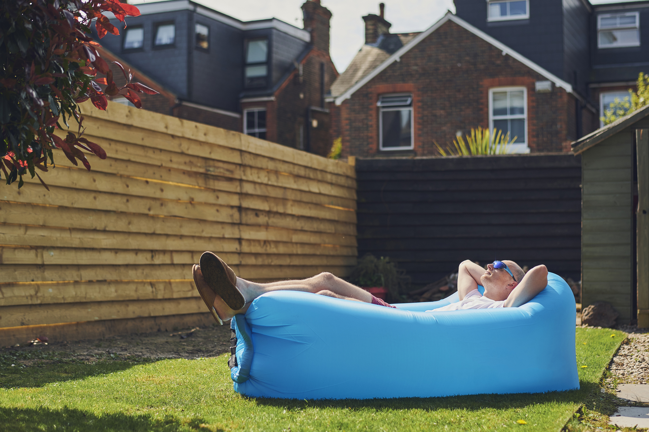 Person laying down on an inflatable lounger.