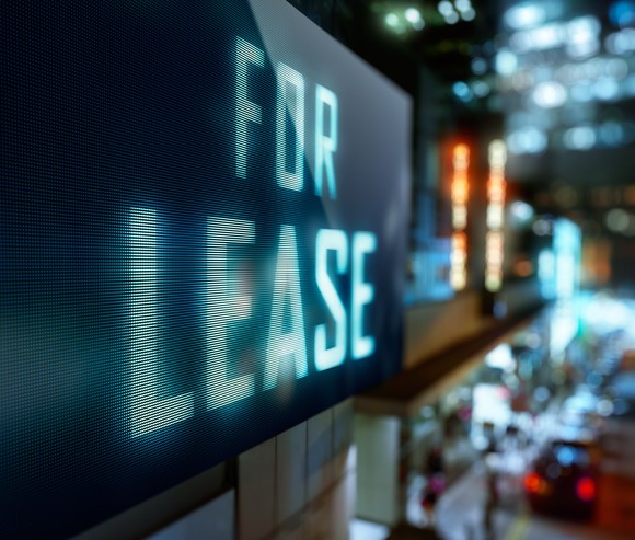 A digital LED sign that reads, For Lease.