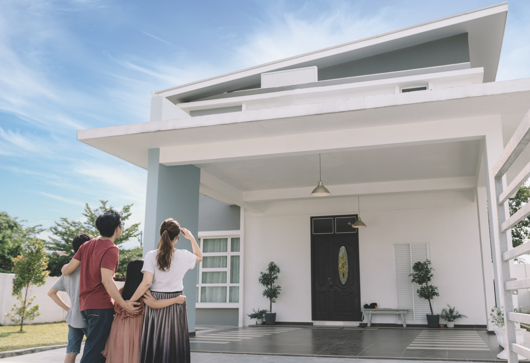 A family looking at a house.