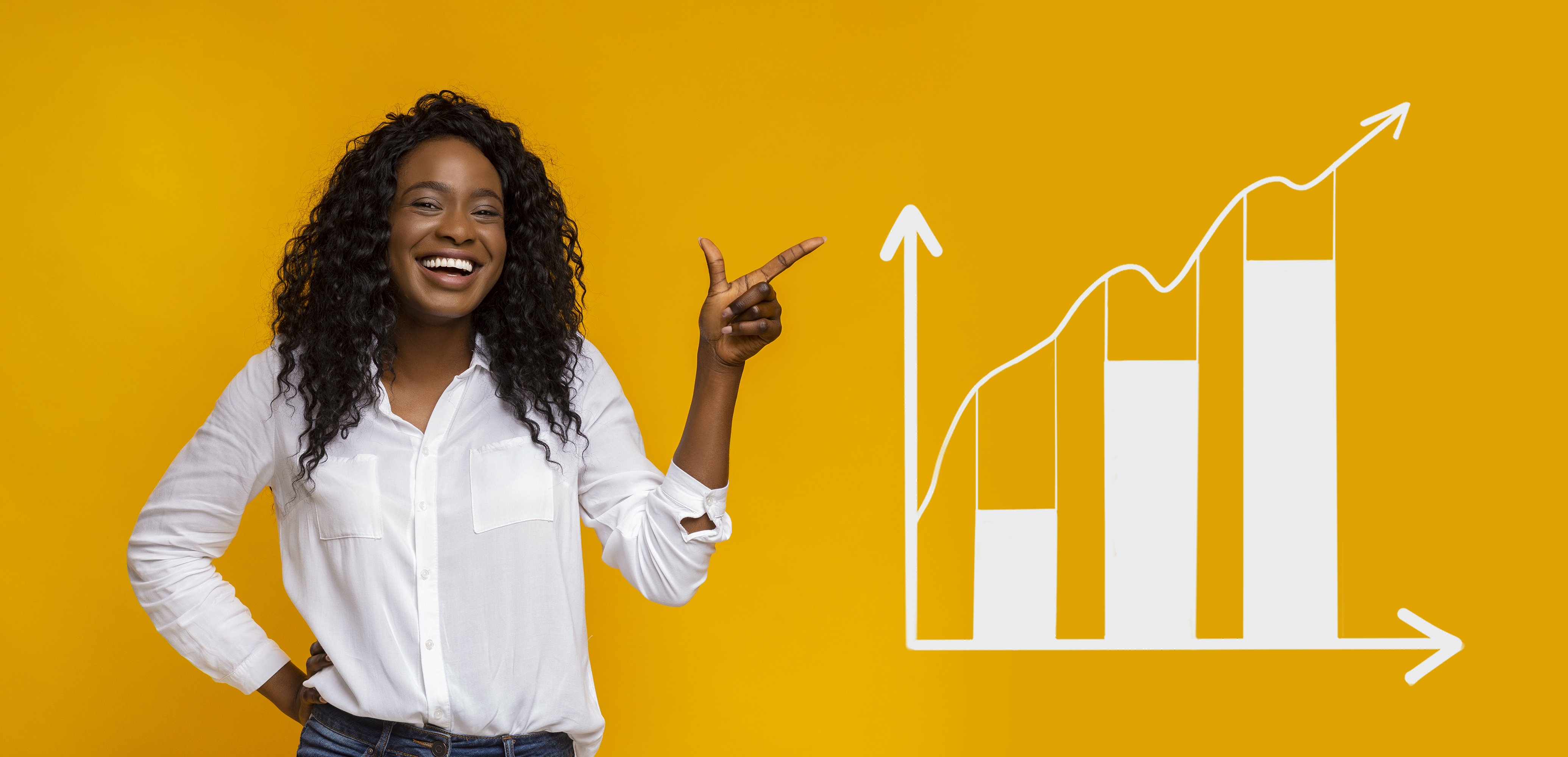 A smiling person points to a rising chart.