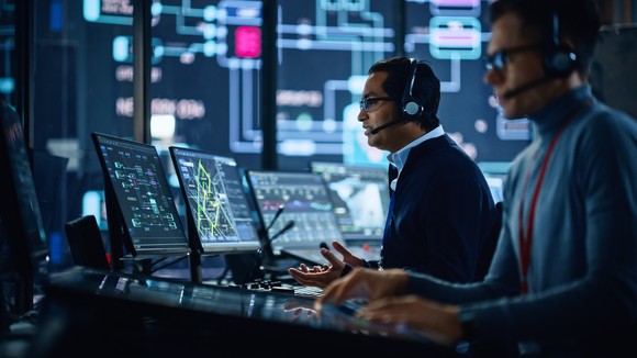 People working in an office on computers.