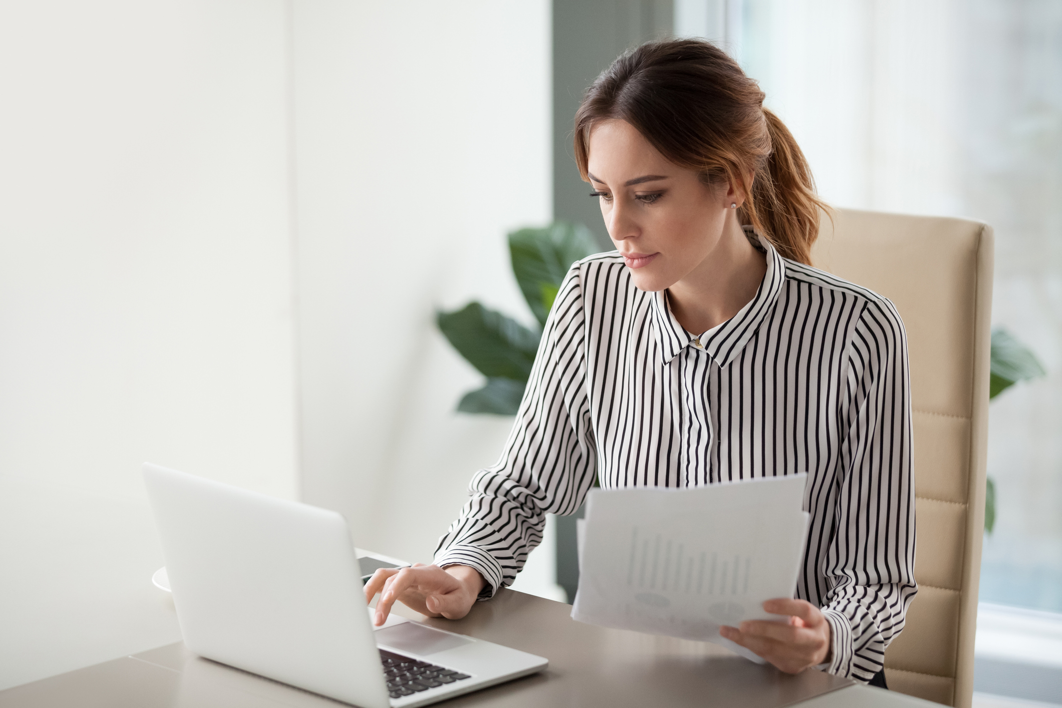 A businessperson prepares a report
