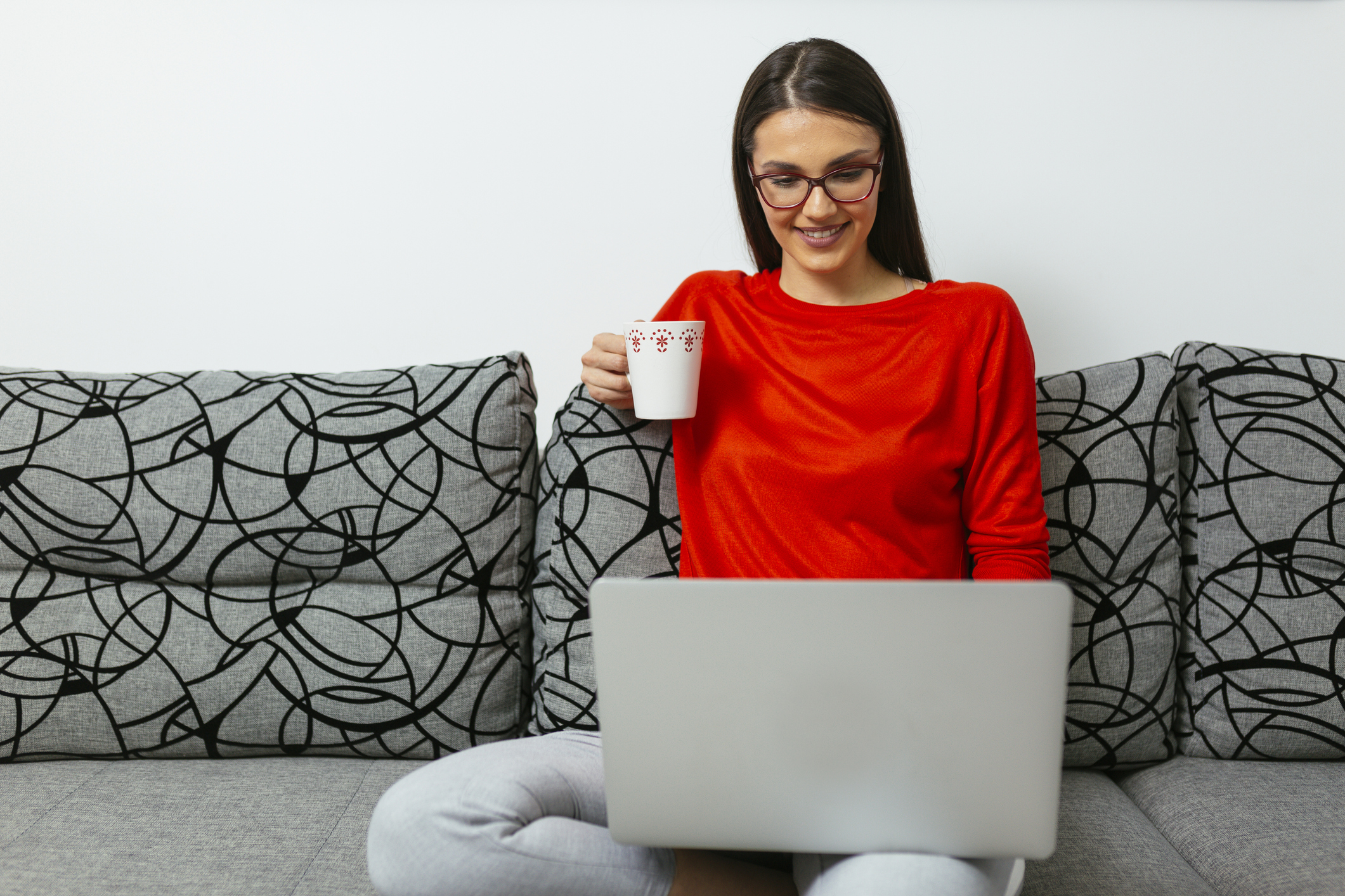 Young woman smiling, laptop