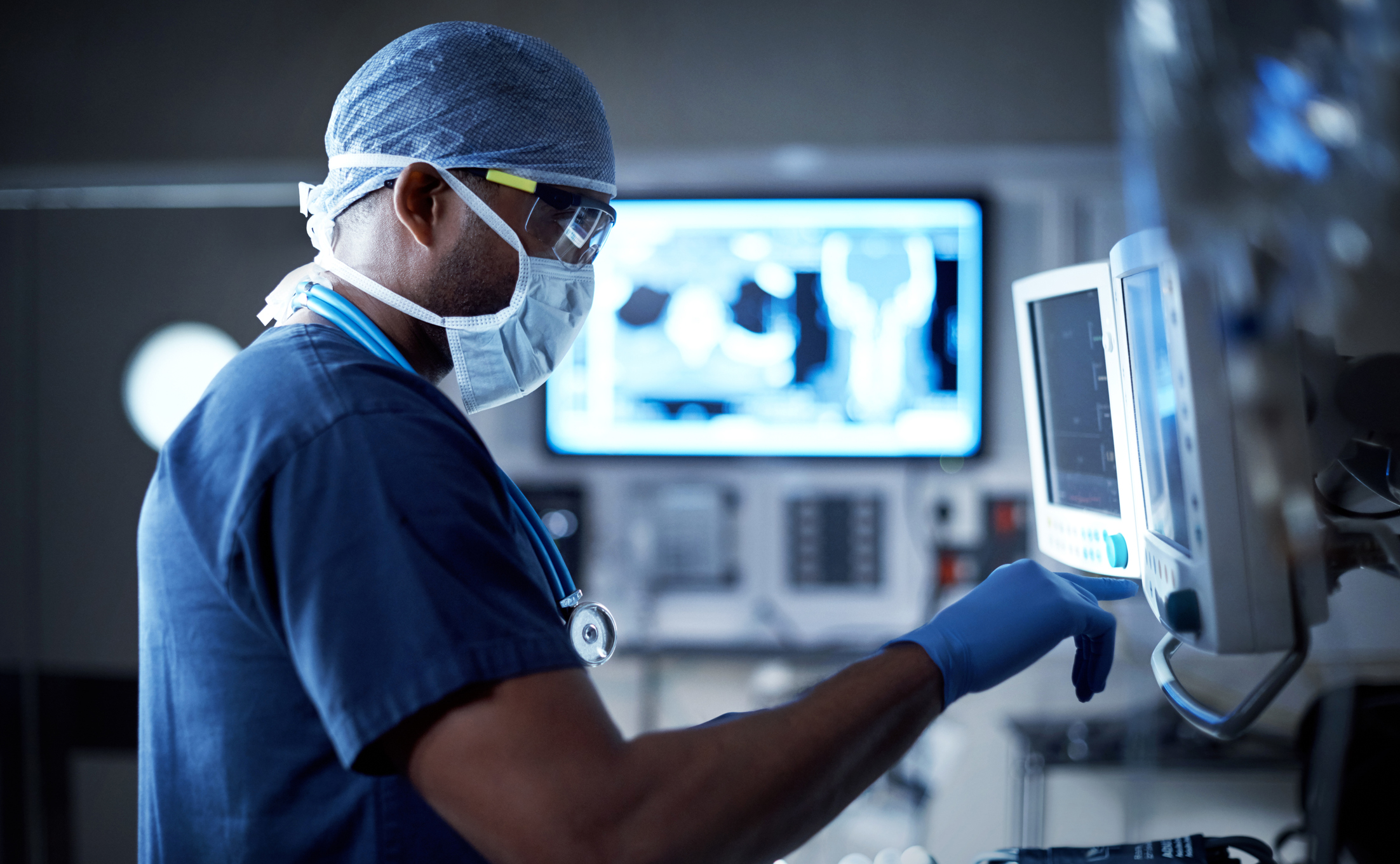 Medical professional working at a computer terminal