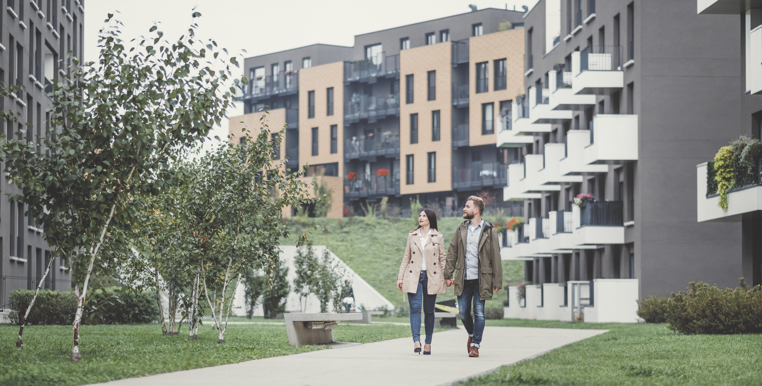 People walking in an apartment community.