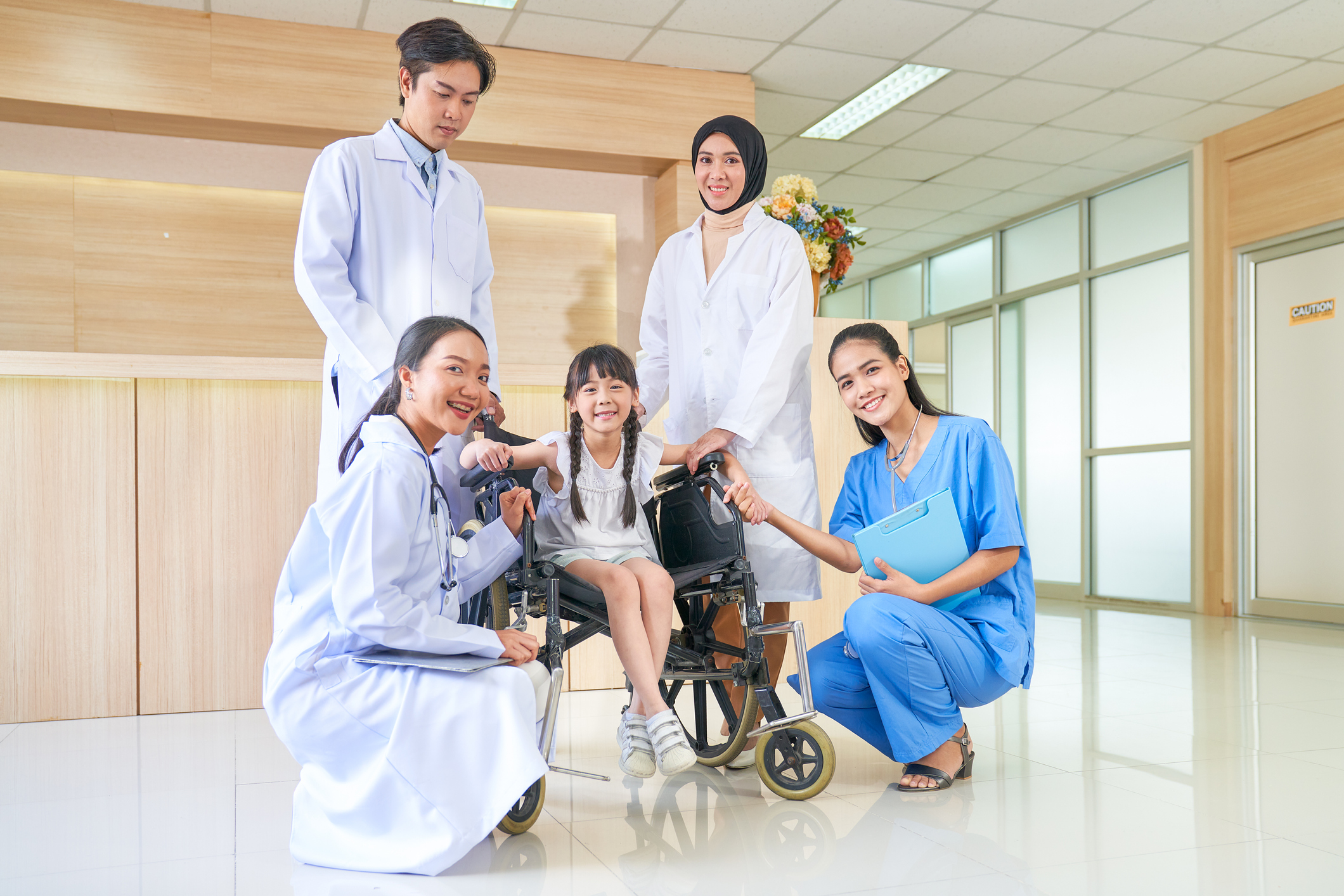 hospital with kid and staff