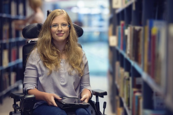 A person sitting in a library.