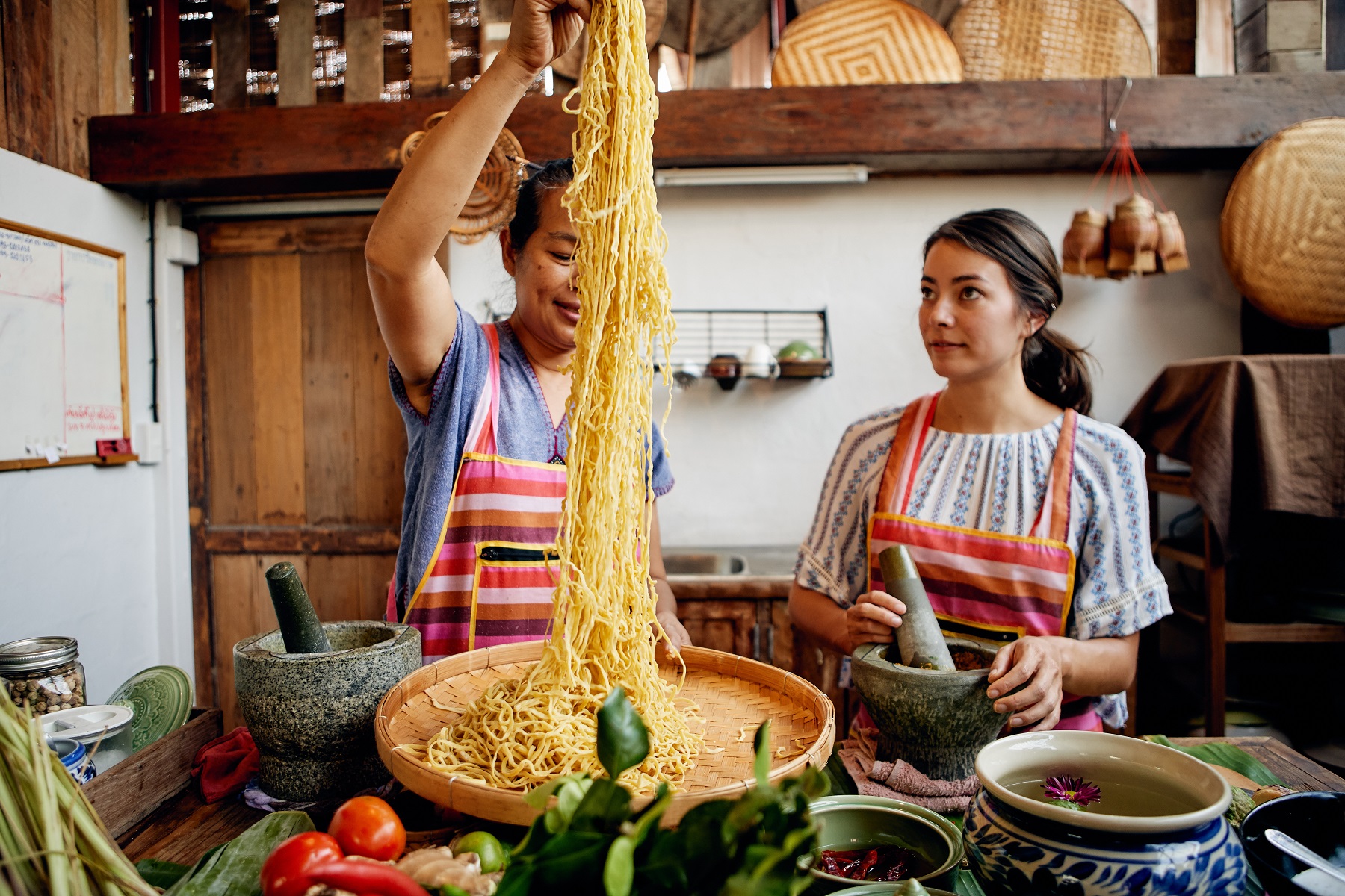 Two people in a kitchen cooking