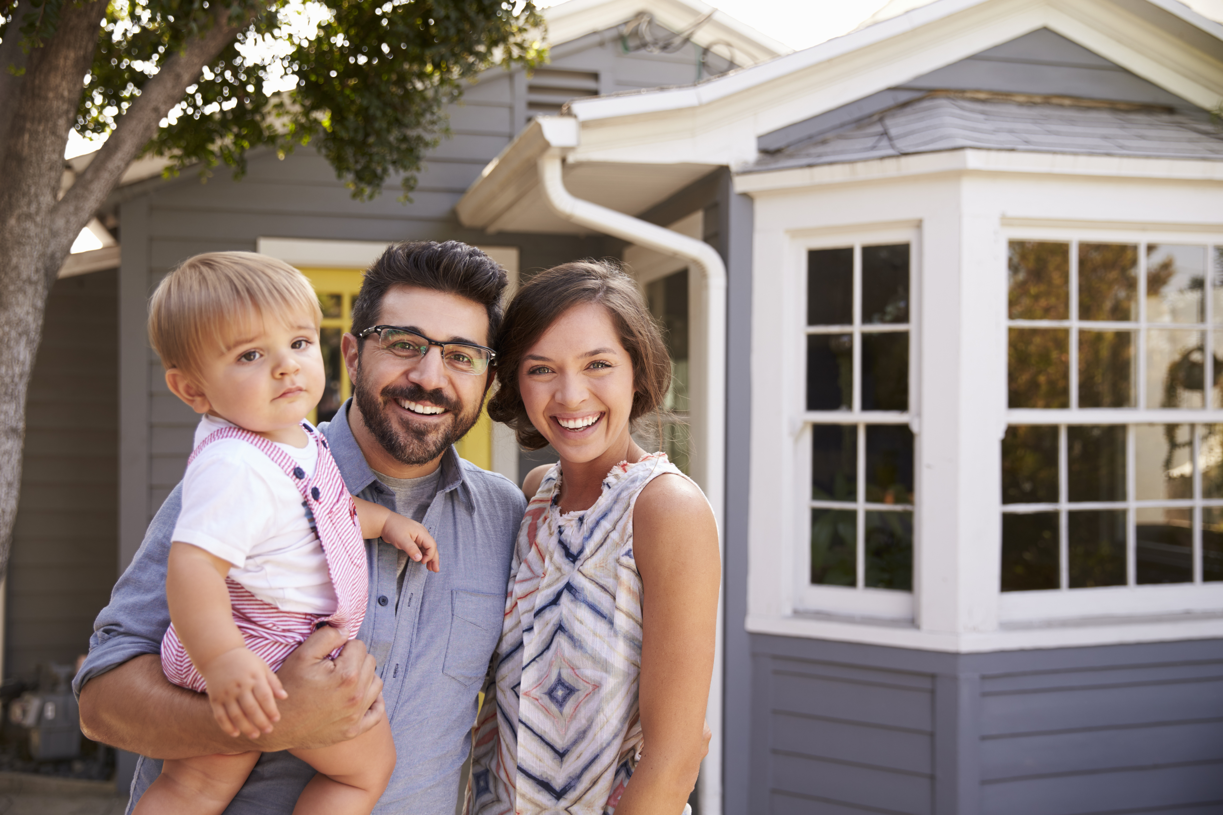 family parents child baby new home homeowner buy house real estate