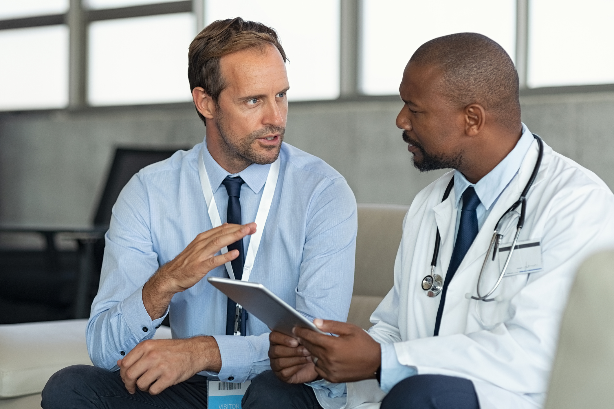 two doctors talk at conference room