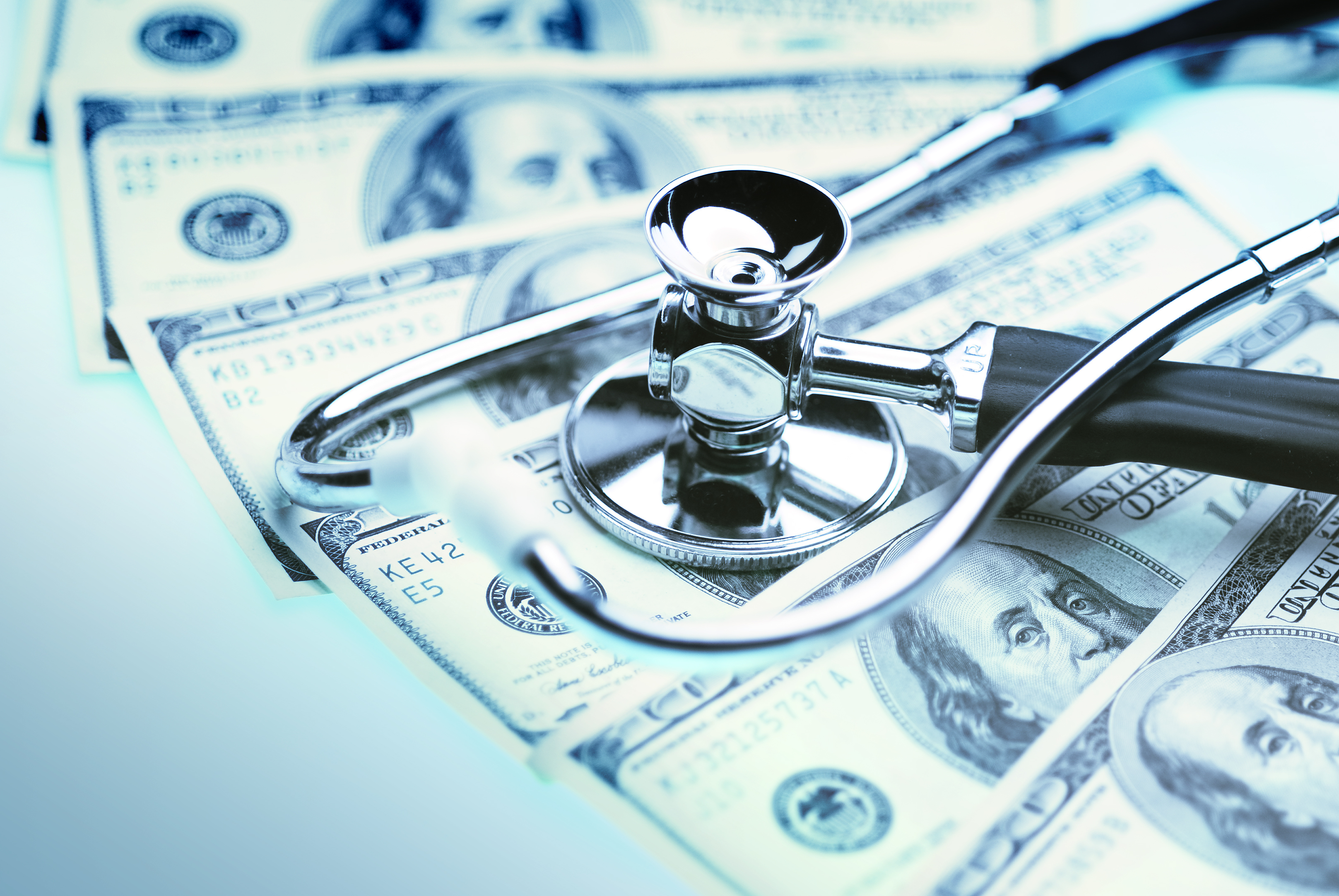 financial health stethoscope money cash hundred bills medical healthcare