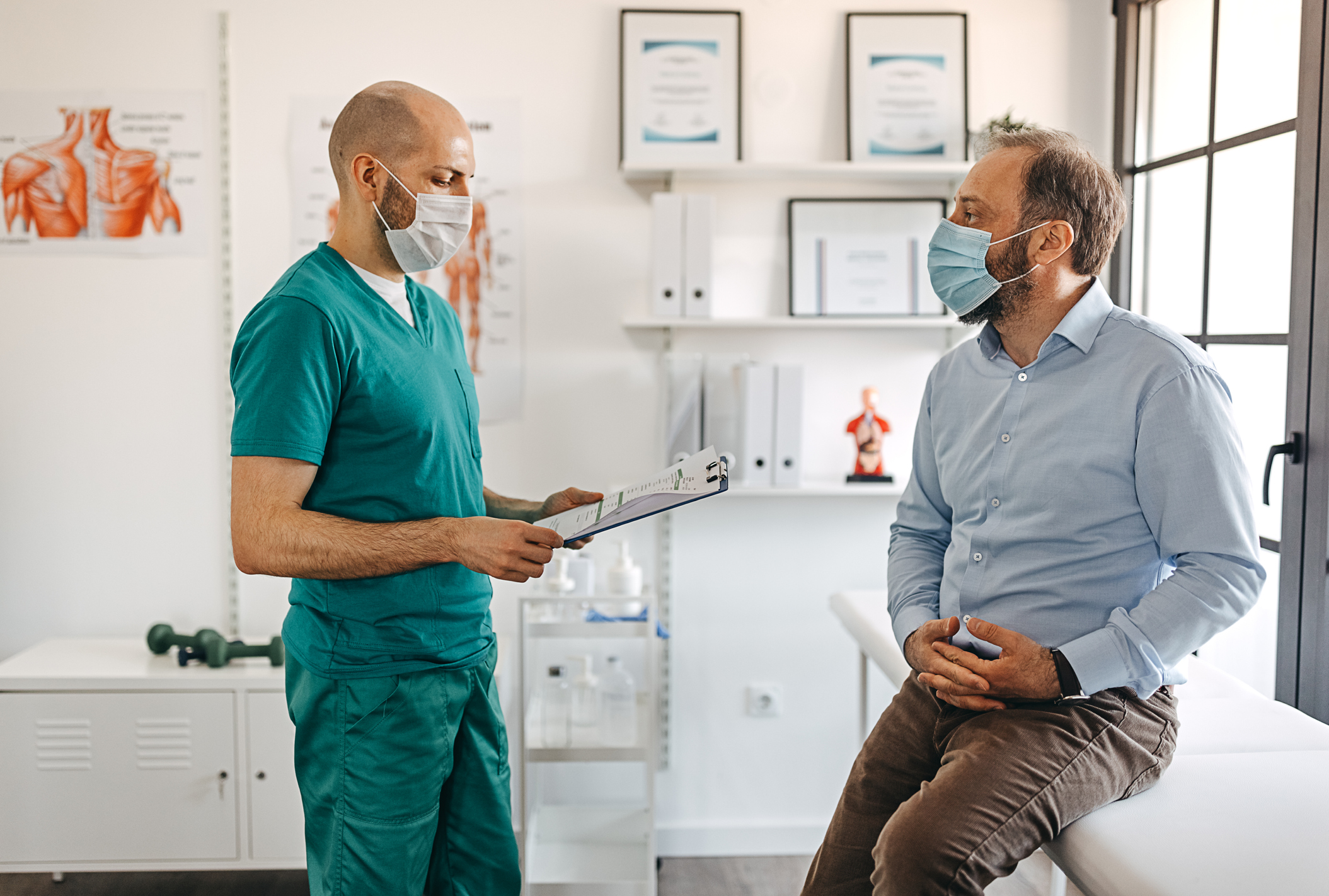 A doctor talks with a patient