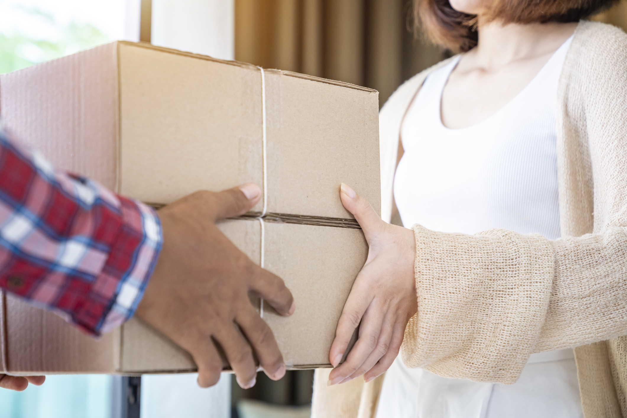 Delivery Man Sending Parcels to Lady