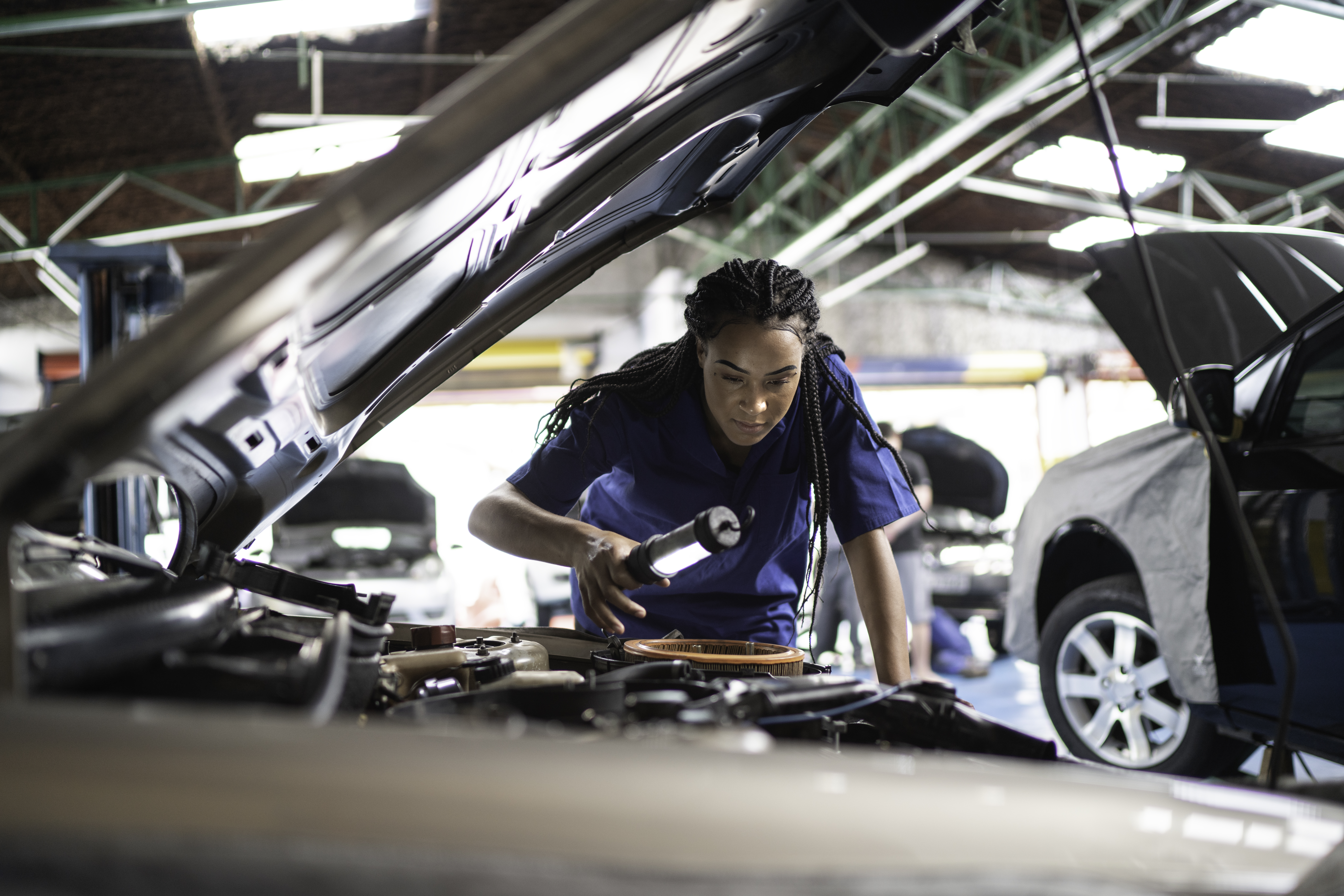 Mechanic working on a car.