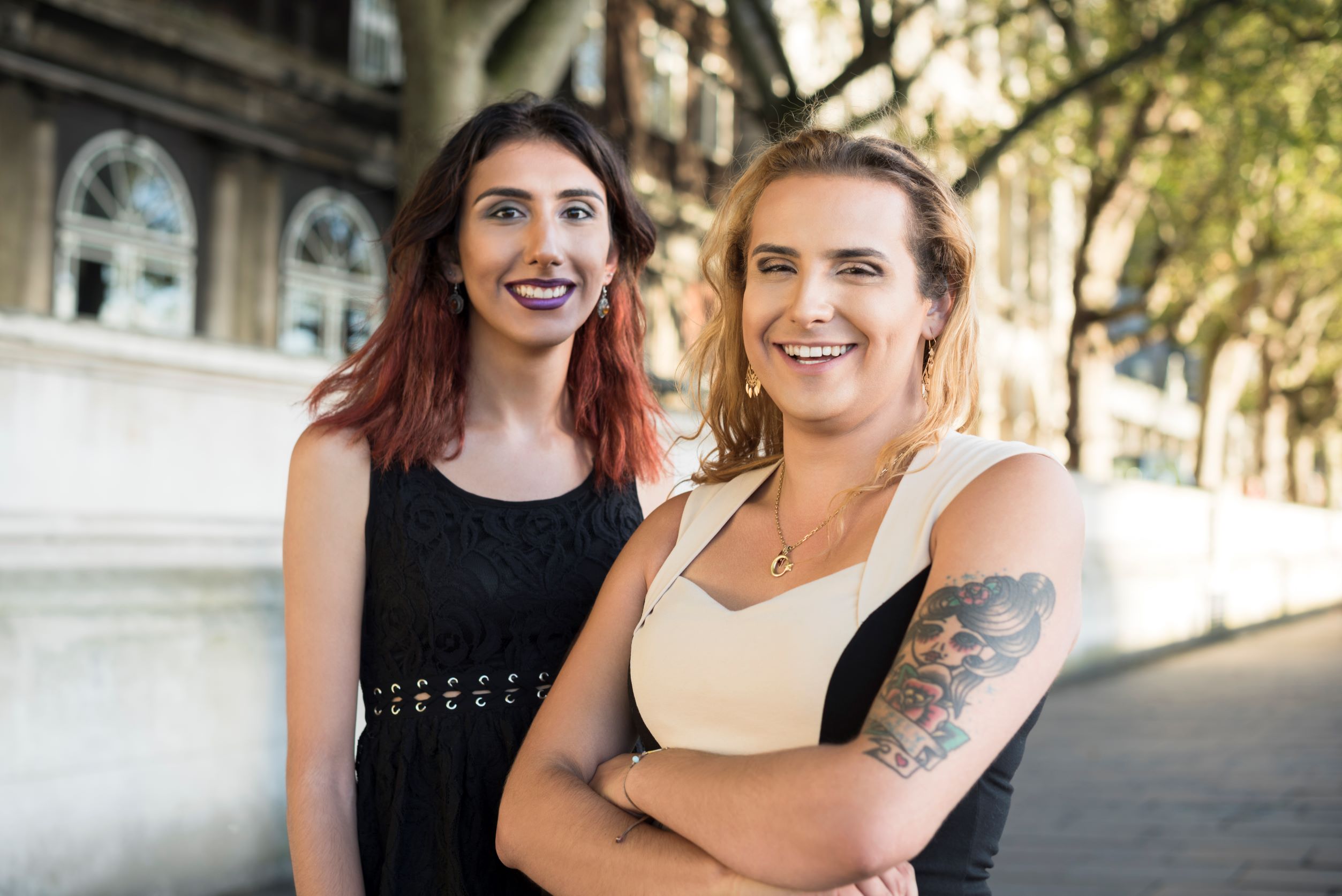 friends smiling outside gender non binary tattoo city